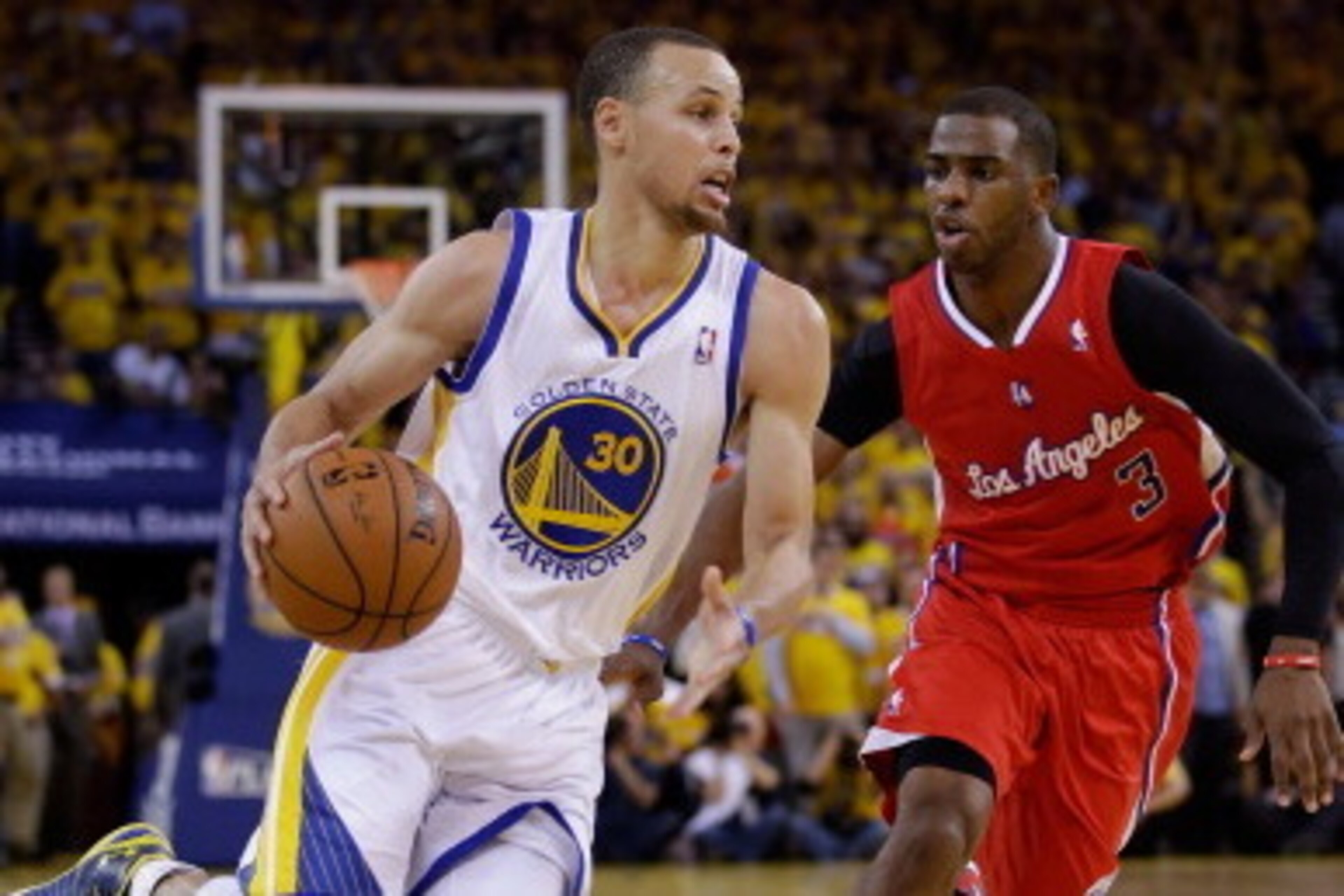 OAKLAND, CA - MAY 01:  Stephen Curry #30 of the Golden State Warriors drives on Chris Paul #3 of the Los Angeles Clippers in Game Six of the Western Conference Quarterfinals during the 2014 NBA Playoffs at ORACLE Arena on May 1, 2014 in Oakland, Californi