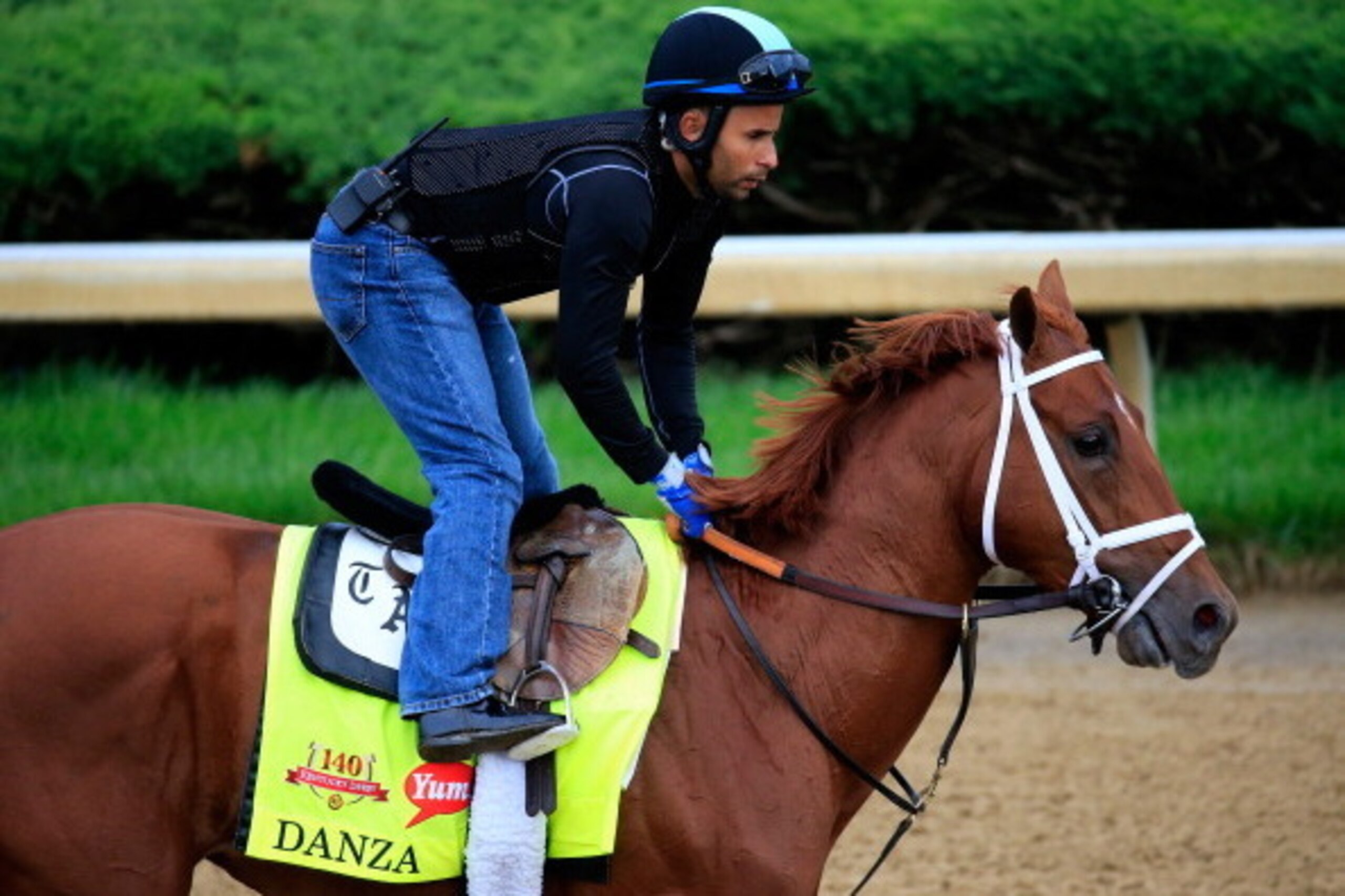 LOUISVILLE, KY - APRIL 30:  Danza ridden by Ezequiel Perez goes over the track during the morning exercise session in preparation for the 140th Kentucky Derby at Churchill Downs on April 30, 2014 in Louisville, Kentucky.  (Photo by Rob Carr/Getty Images)