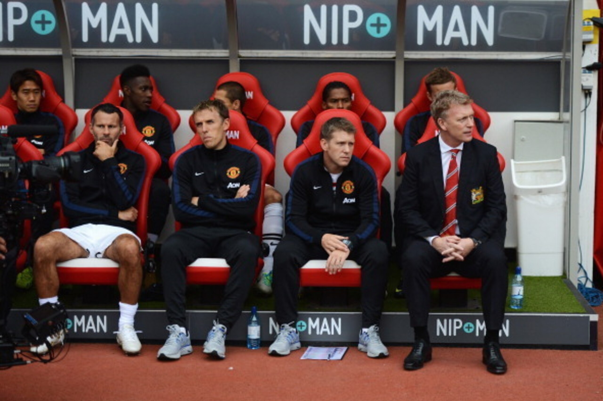 SUNDERLAND, ENGLAND - OCTOBER 05:  David Moyes (R), manager of Manchester United sits with (front row L-R) Ryan Giggs, Phil Neville and assistant Steve Round during the Barclays Premier League match between Sunderland and Manchester United at the Stadium 