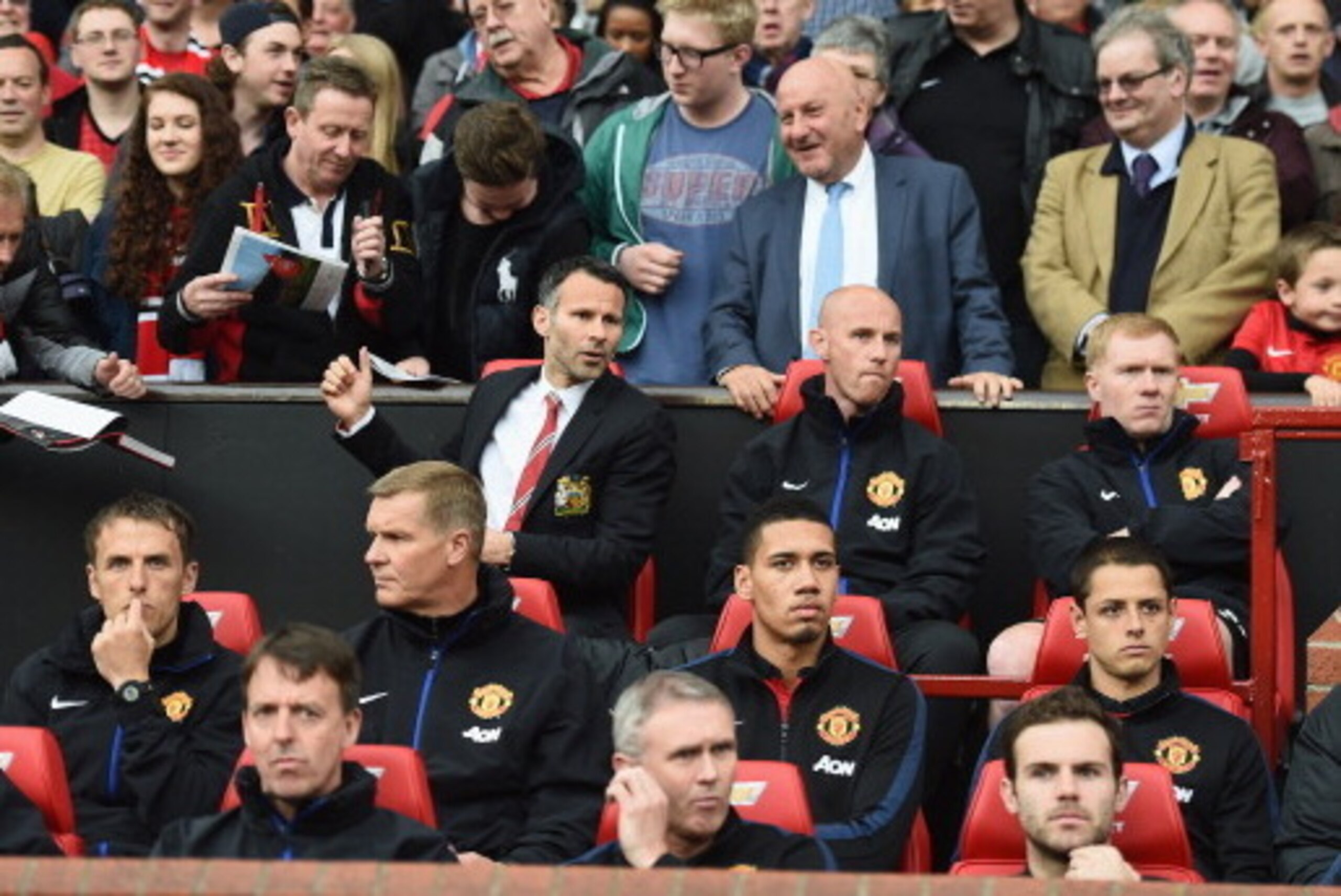 MANCHESTER, ENGLAND - APRIL 26:  Ryan Giggs of Manchester United takes his seat in the dug out during the Barclays Premier League match between Manchester United and Norwich City at Old Trafford on April 26, 2014 in Manchester, England.  (Photo by Laurenc