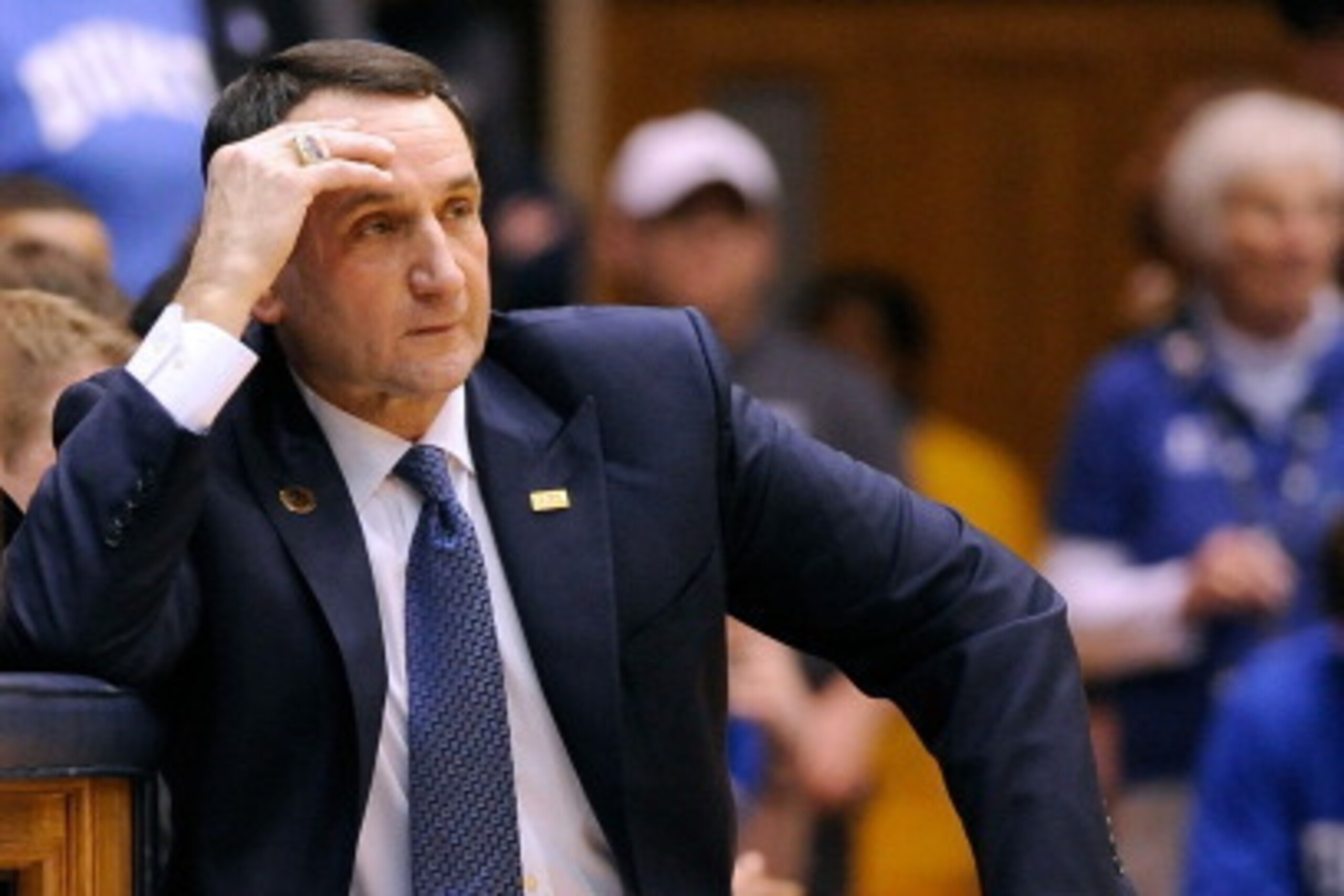 DURHAM, NC - FEBRUARY 04:  Head coach Mike Krzyzewski of the Duke Blue Devils reacts to a foul called against his team during their game against the Wake Forest Demon Deacons at Cameron Indoor Stadium on February 4, 2014 in Durham, North Carolina. Duke wo
