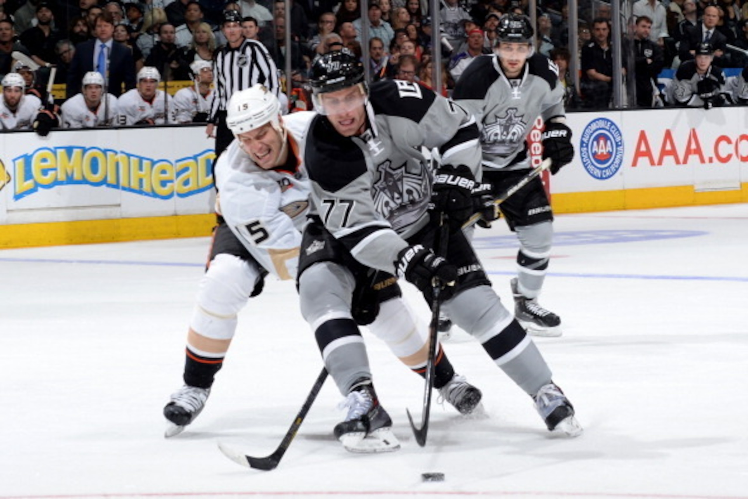 LOS ANGELES, CA - APRIL 12: Jeff Carter #77 of the Los Angeles Kings skates with the puck against Ryan Getzlaf #15 of the Anaheim Ducks at Staples Center on April 12, 2014 in Los Angeles, California. (Photo by Noah Graham/NHLI via Getty Images)
