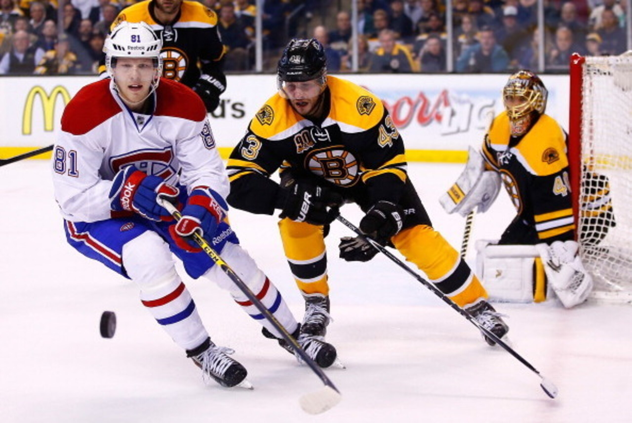 BOSTON, MA - MAY 01: Matt Bartkowski #43 of the Boston Bruins and Lars Eller #81 of the Montreal Canadiens chase down a puck into the corner in the first overtime period in Game One of the Second Round of the 2014 NHL Stanley Cup Playoffs on May 1, 2014 i