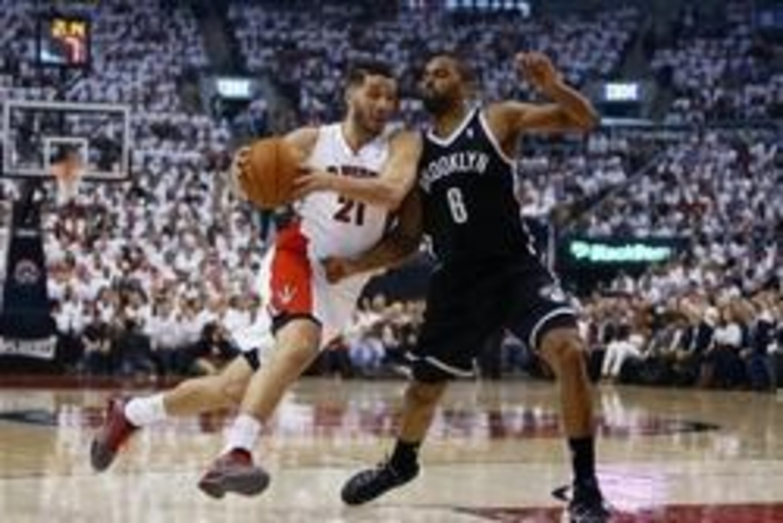 Apr 22, 2014; Toronto, Ontario, CAN; Toronto Raptors guard Greivis Vasquez (21)  drives to the net against Brooklyn Nets forward/guard Alan Anderson (6) first half of game two during the first round of the 2014 NBA Playoffs at Air Canada Centre. Mandatory