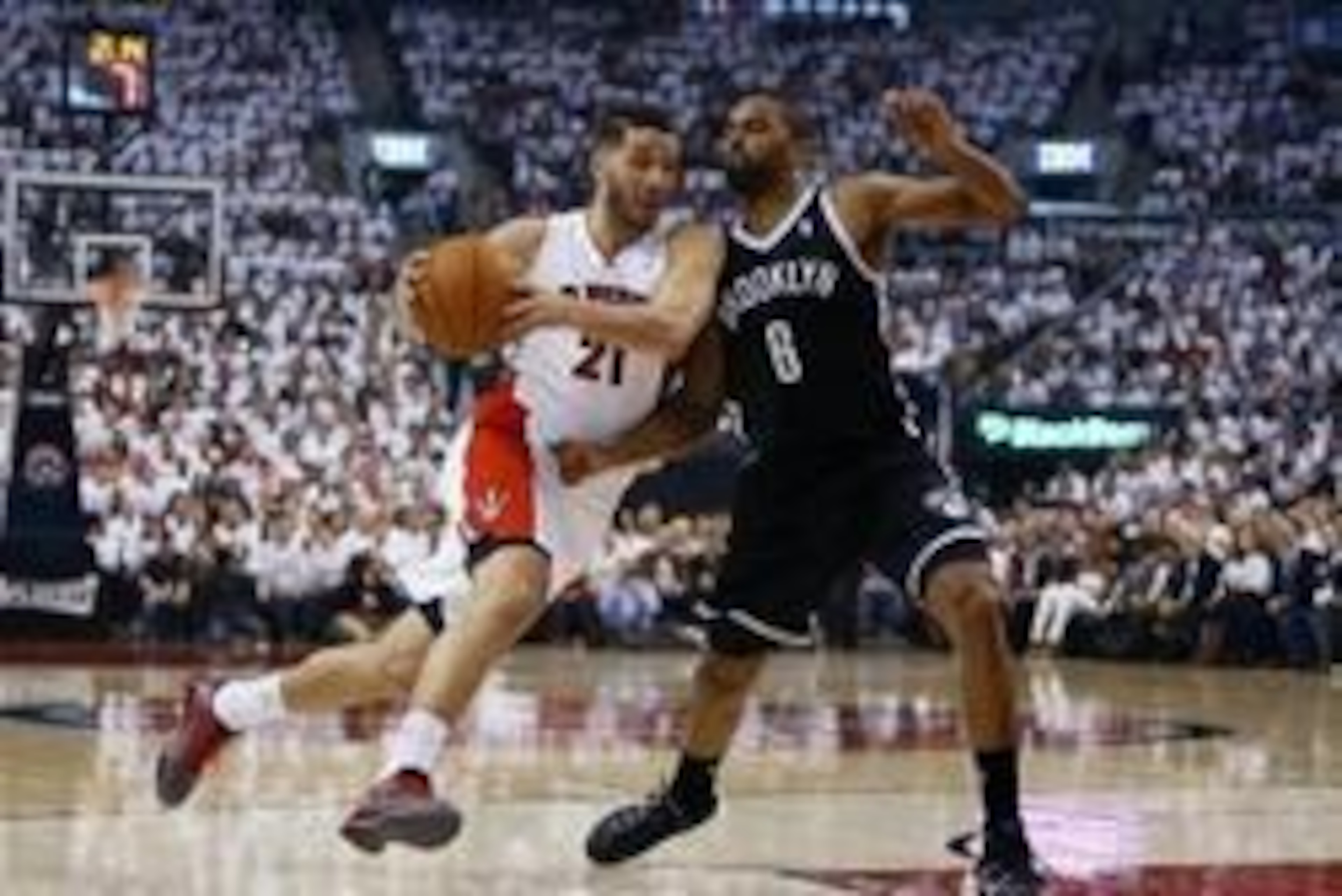 Apr 22, 2014; Toronto, Ontario, CAN; Toronto Raptors guard Greivis Vasquez (21)  drives to the net against Brooklyn Nets forward/guard Alan Anderson (6) first half of game two during the first round of the 2014 NBA Playoffs at Air Canada Centre. Mandatory