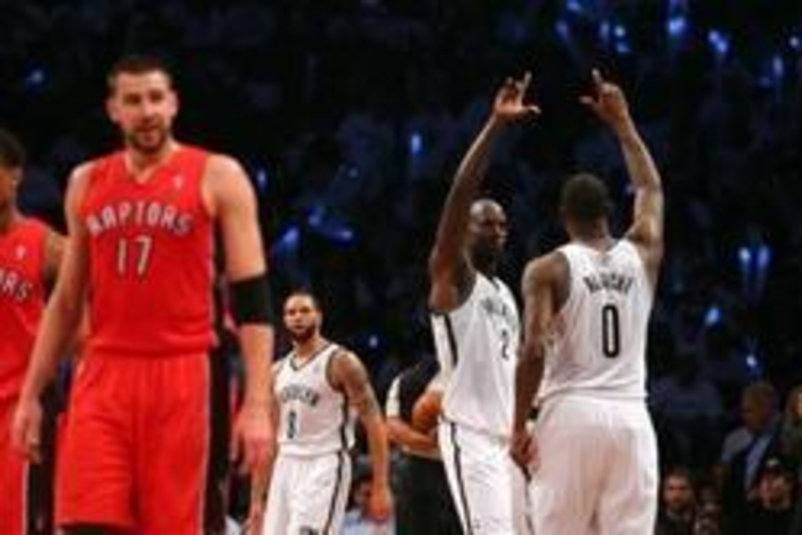 May 2, 2014; Brooklyn, NY, USA; Brooklyn Nets center Kevin Garnett (2) and center Andray Blatche (0) react as Toronto Raptors center Jonas Valanciunas (17) also reacts during the third quarter of game six of the first round of the 2014 NBA Playoffs at Bar