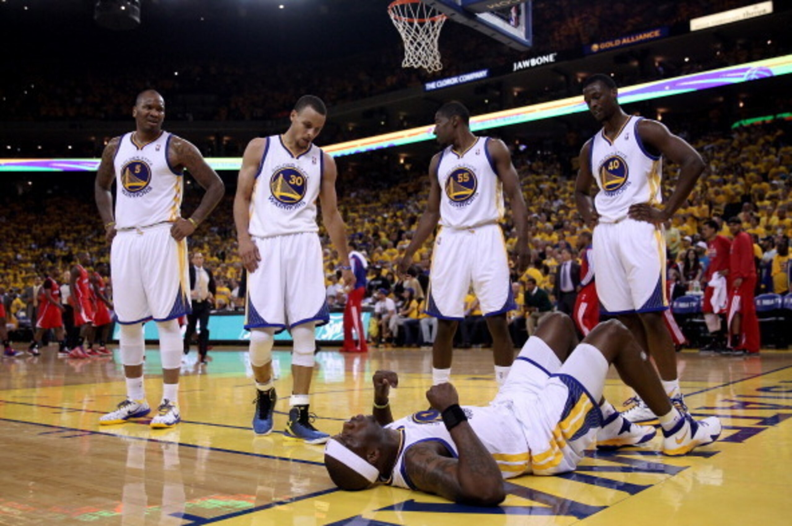 OAKLAND, CA - MAY 01:  Jermaine O'Neal #7 of the Golden State Warriors lies on the floor injured after being fouled by the Los Angeles Clippers in Game Six of the Western Conference Quarterfinals during the 2014 NBA Playoffs at ORACLE Arena on May 1, 2014