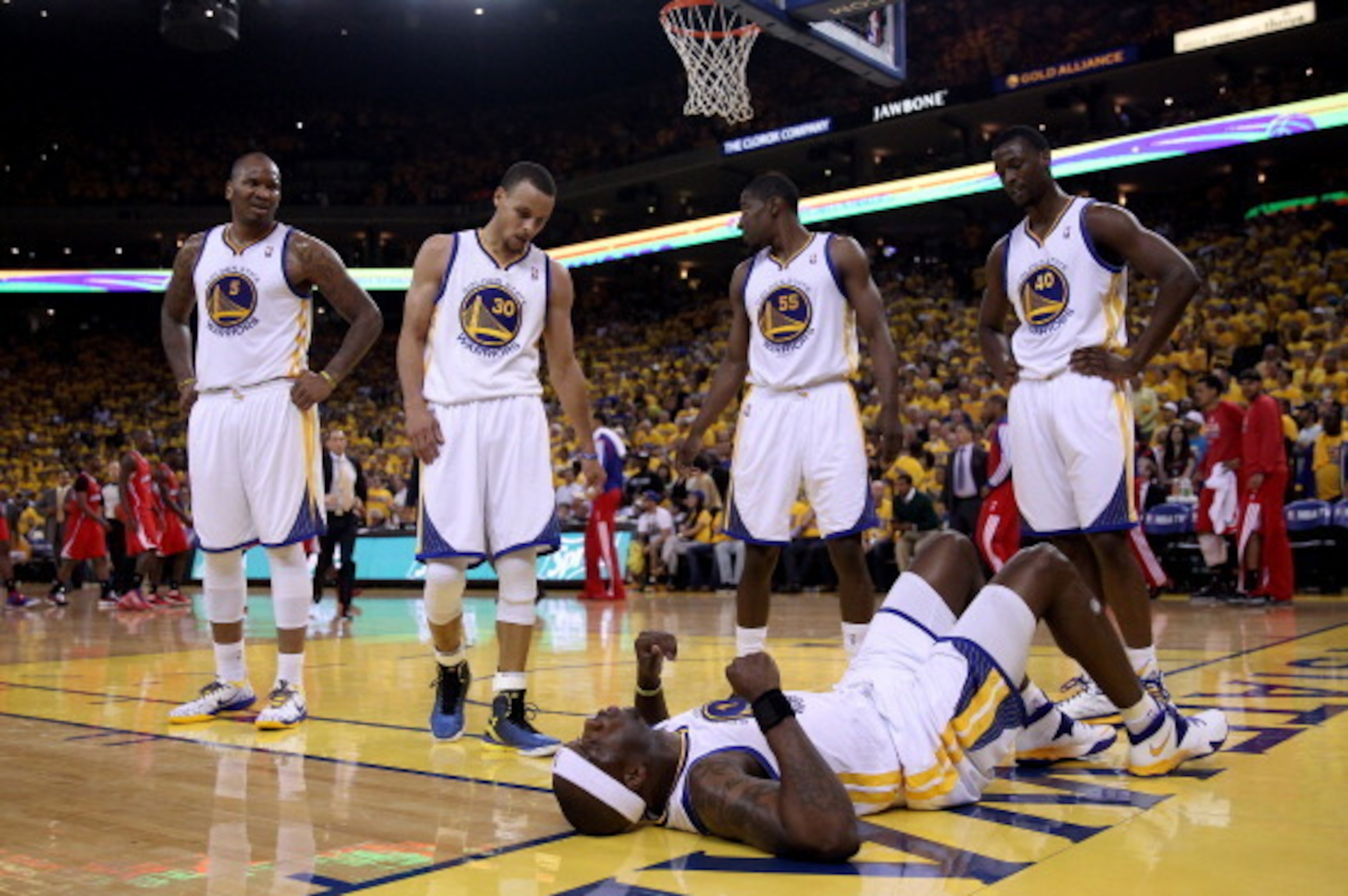 OAKLAND, CA - MAY 01:  Jermaine O'Neal #7 of the Golden State Warriors lies on the floor injured after being fouled by the Los Angeles Clippers in Game Six of the Western Conference Quarterfinals during the 2014 NBA Playoffs at ORACLE Arena on May 1, 2014