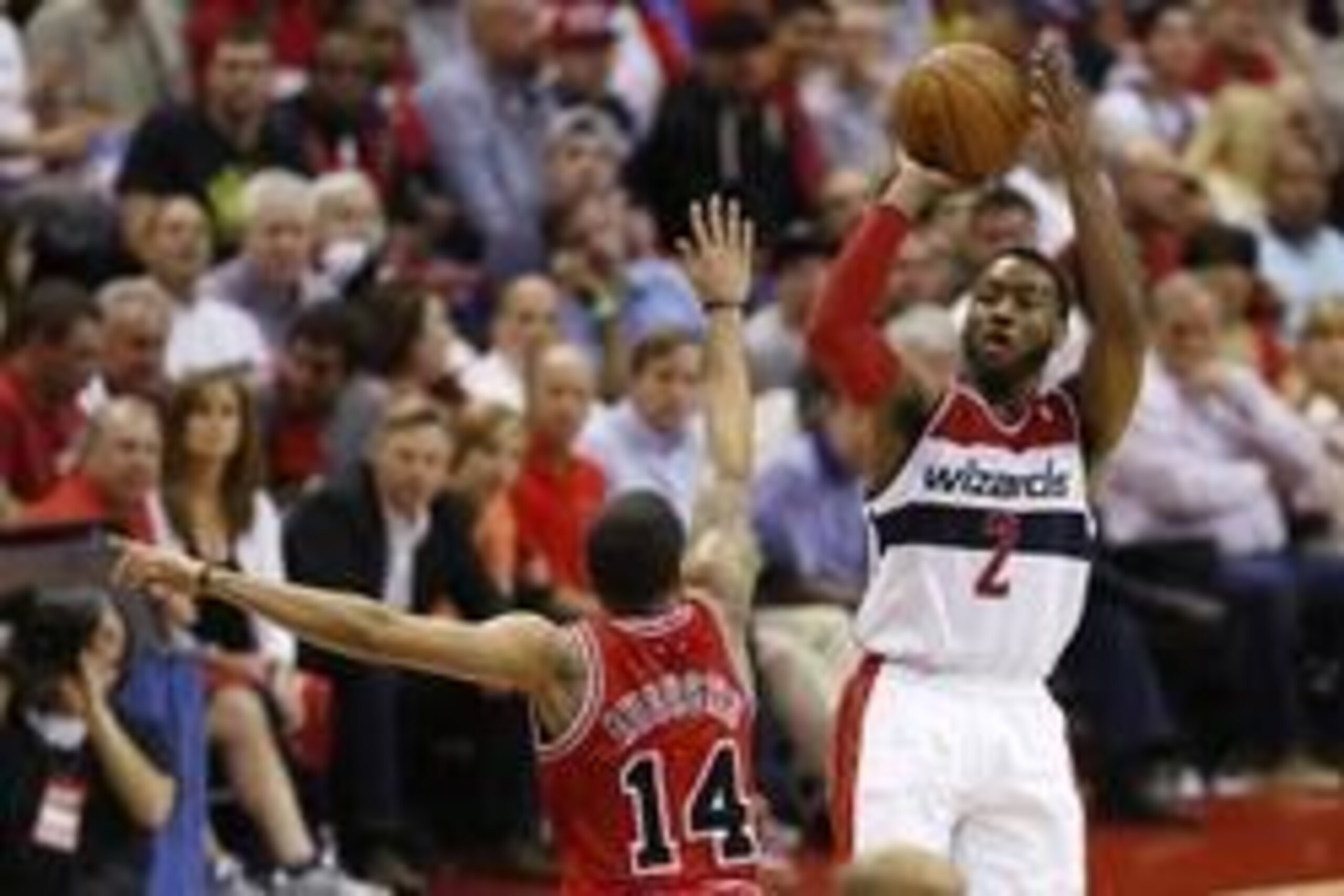 Apr 27, 2014; Washington, DC, USA; Washington Wizards guard John Wall (2) shoots the ball over Chicago Bulls guard D.J. Augustin (14) in the third quarter in game four of the first round of the 2014 NBA Playoffs at Verizon Center. The Wizards won 98-89. M