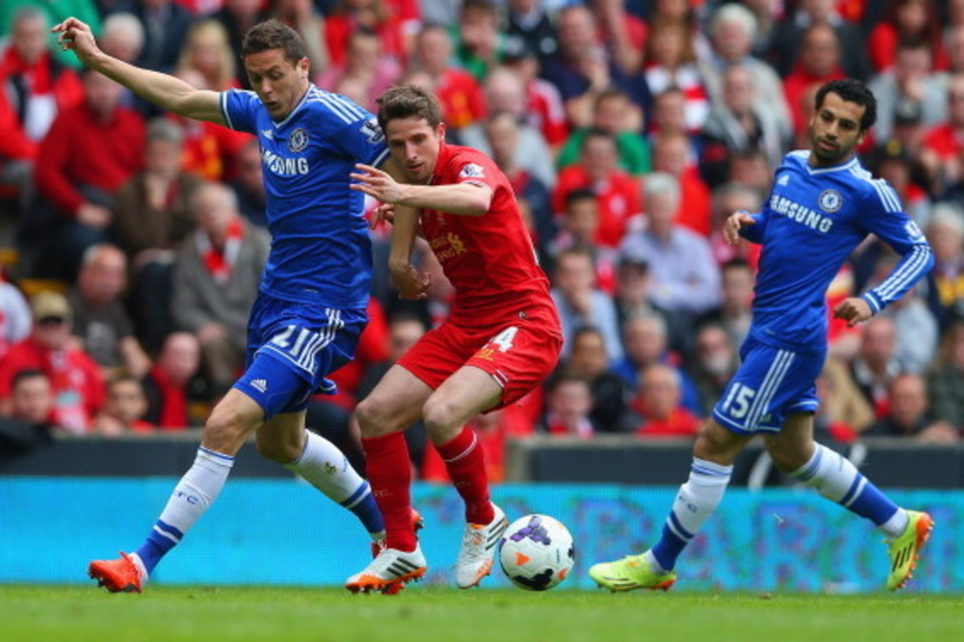 LIVERPOOL, ENGLAND - APRIL 27:  Nemanja Matic of Chelsea and Joe Allen of Liverpool compete for the ball during the Barclays Premier League match between Liverpool and Chelsea at Anfield on April 27, 2014 in Liverpool, England.  (Photo by Clive Brunskill/