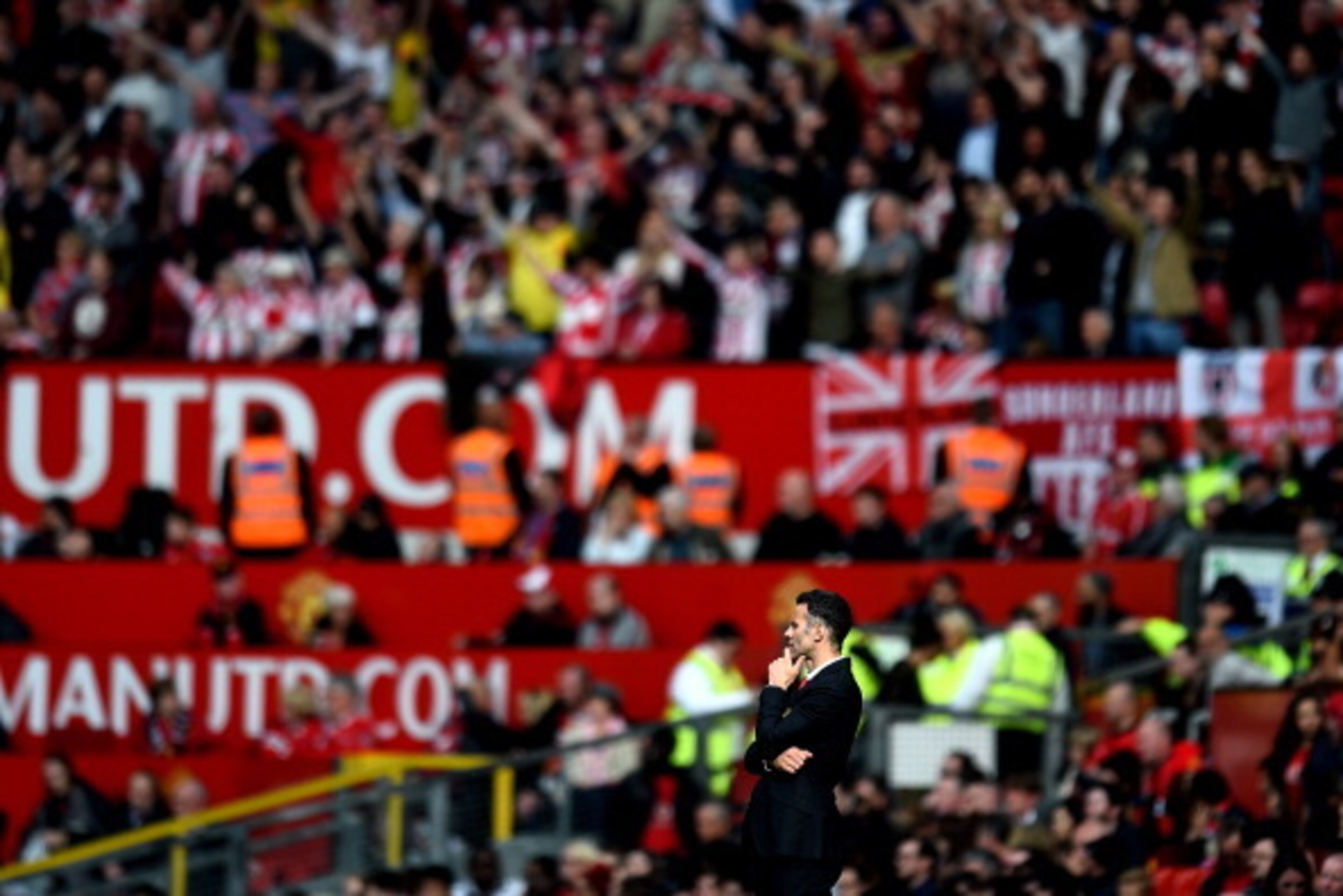 MANCHESTER, ENGLAND - MAY 03:  A dejected Ryan Giggs the Manchester United interim manager looks on during the Barclays Premier League match between Manchester United and Sunderland at Old Trafford on May 3, 2014 in Manchester, England.  (Photo by Shaun B