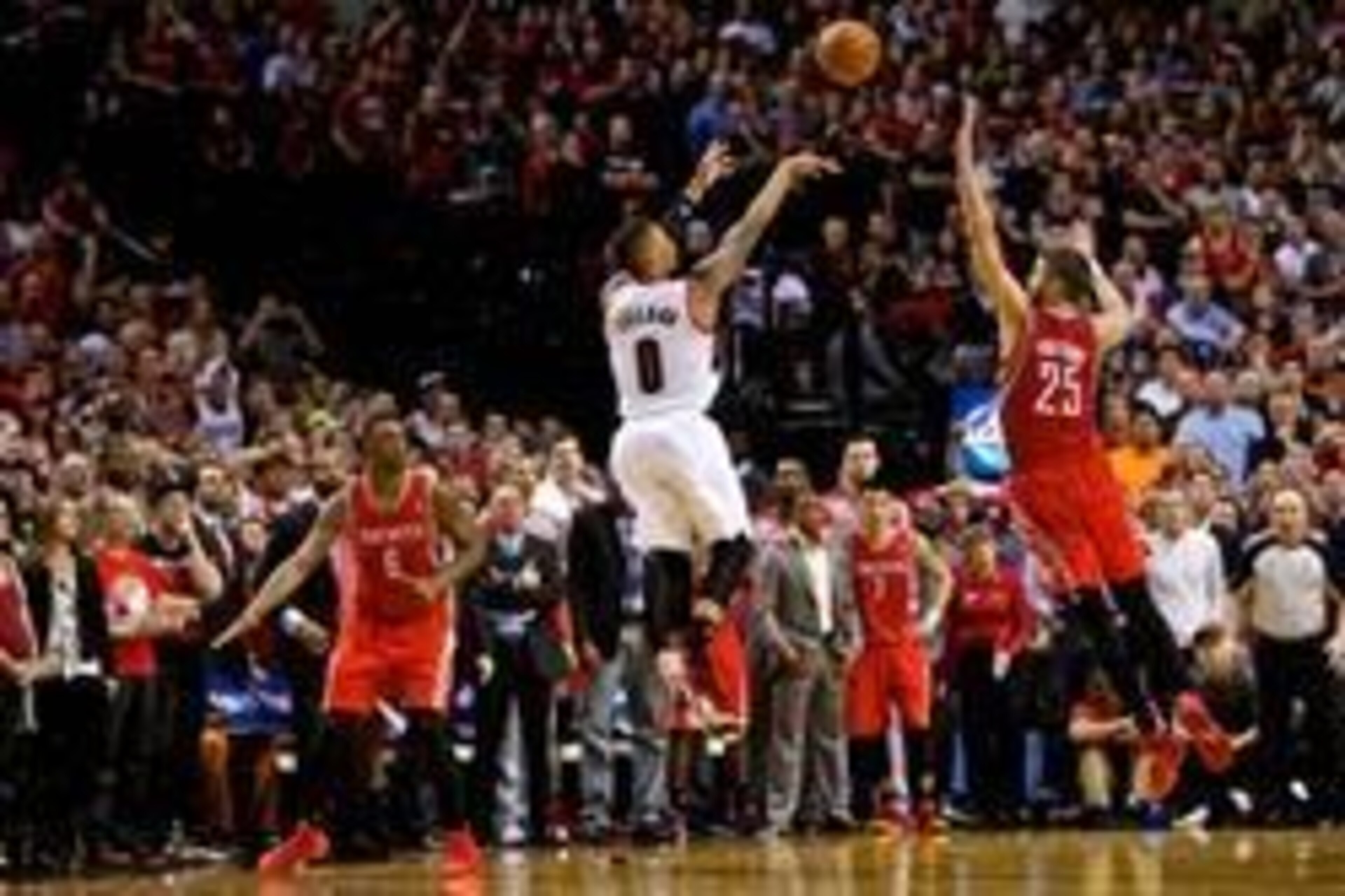 May 2, 2014; Portland, OR, USA; Portland Trail Blazers guard Damian Lillard (0) makes a three pointer at the buzzer over Houston Rockets forward Chandler Parsons (25) to win the game during the fourth quarter in game six of the first round of the 2014 NBA May 2, 2014; Portland, OR, USA; Portland Trail Blazers guard Damian Lillard (0) makes a three pointer at the buzzer over Houston Rockets forward Chandler Parsons (25) to win the game during the fourth quarter in game six of the first round of the 2014 NBA