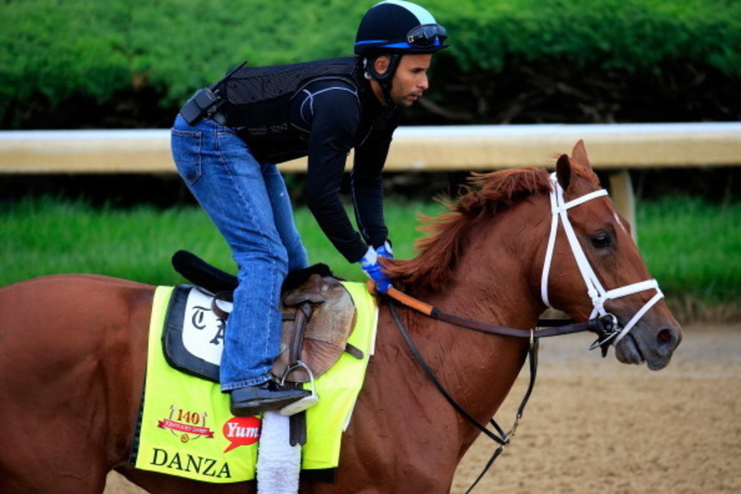 LOUISVILLE, KY - APRIL 30:  Danza ridden by Ezequiel Perez goes over the track during the morning exercise session in preparation for the 140th Kentucky Derby at Churchill Downs on April 30, 2014 in Louisville, Kentucky.  (Photo by Rob Carr/Getty Images)