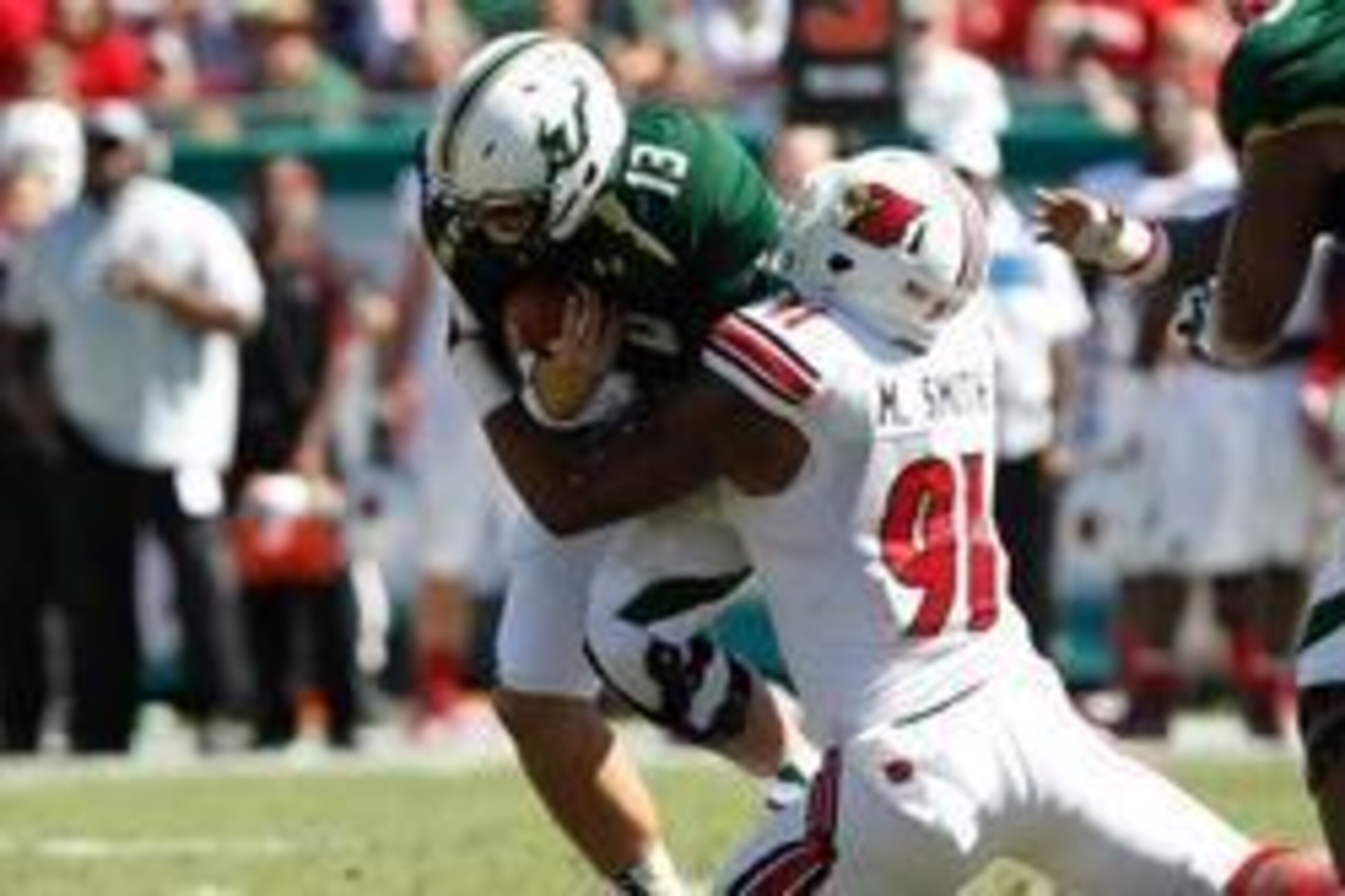 Oct 26, 2013; Tampa, FL, USA; Louisville Cardinals defensive end Marcus Smith (91) sacks South Florida Bulls quarterback Bobby Eveld (13) during the first half at Raymond James Stadium. Mandatory Credit: Kim Klement-USA TODAY Sports