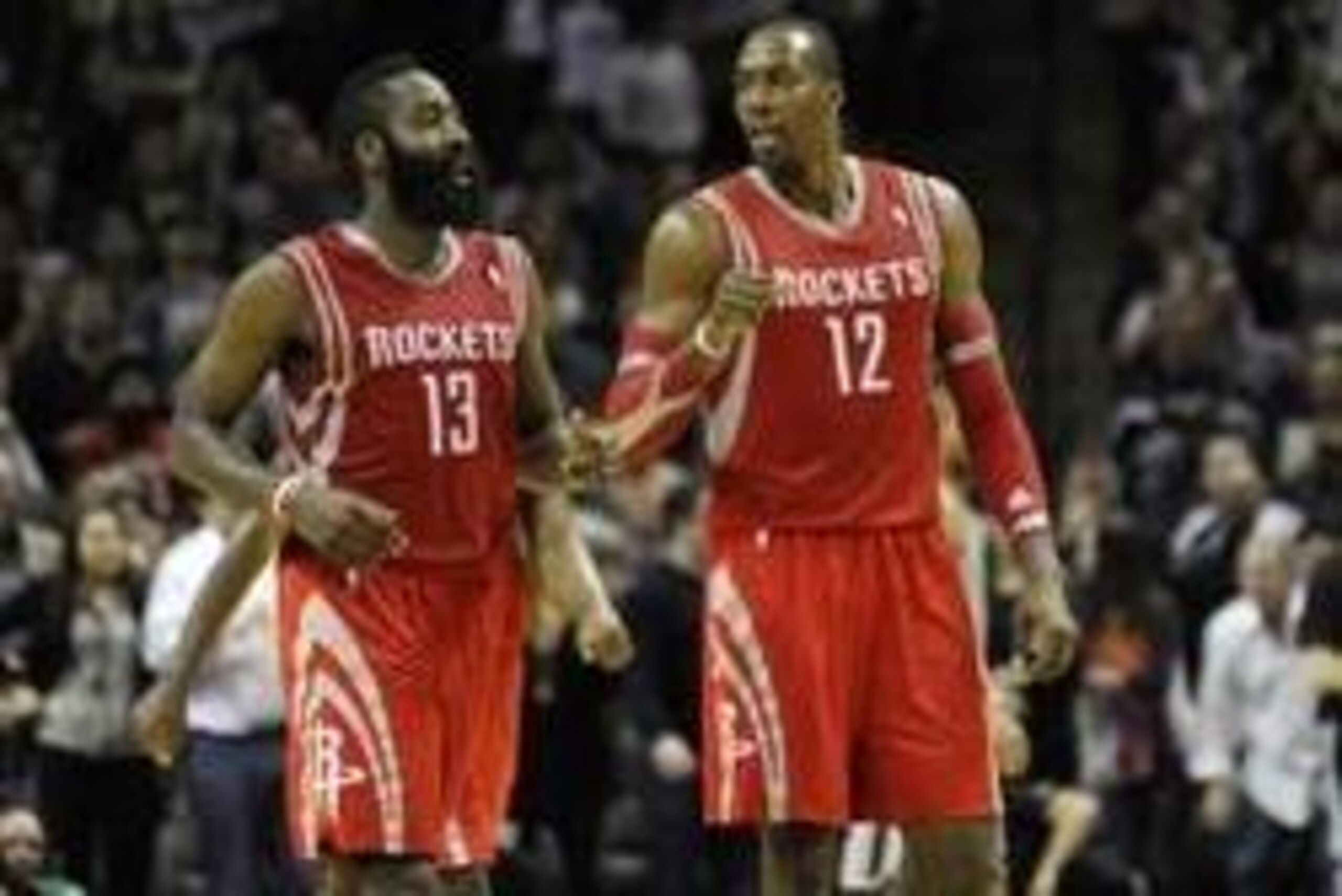Nov 30, 2013; San Antonio, TX, USA; Houston Rockets guard James Harden (13) and forward Dwight Howard (12) react against the San Antonio Spurs during the second half at the AT&T Center. Houston beat San Antonio 112-106. Mandatory Credit: Brendan Maloney-U Nov 30, 2013; San Antonio, TX, USA; Houston Rockets guard James Harden (13) and forward Dwight Howard (12) react against the San Antonio Spurs during the second half at the AT&T Center. Houston beat San Antonio 112-106. Mandatory Credit: Brendan Maloney-U