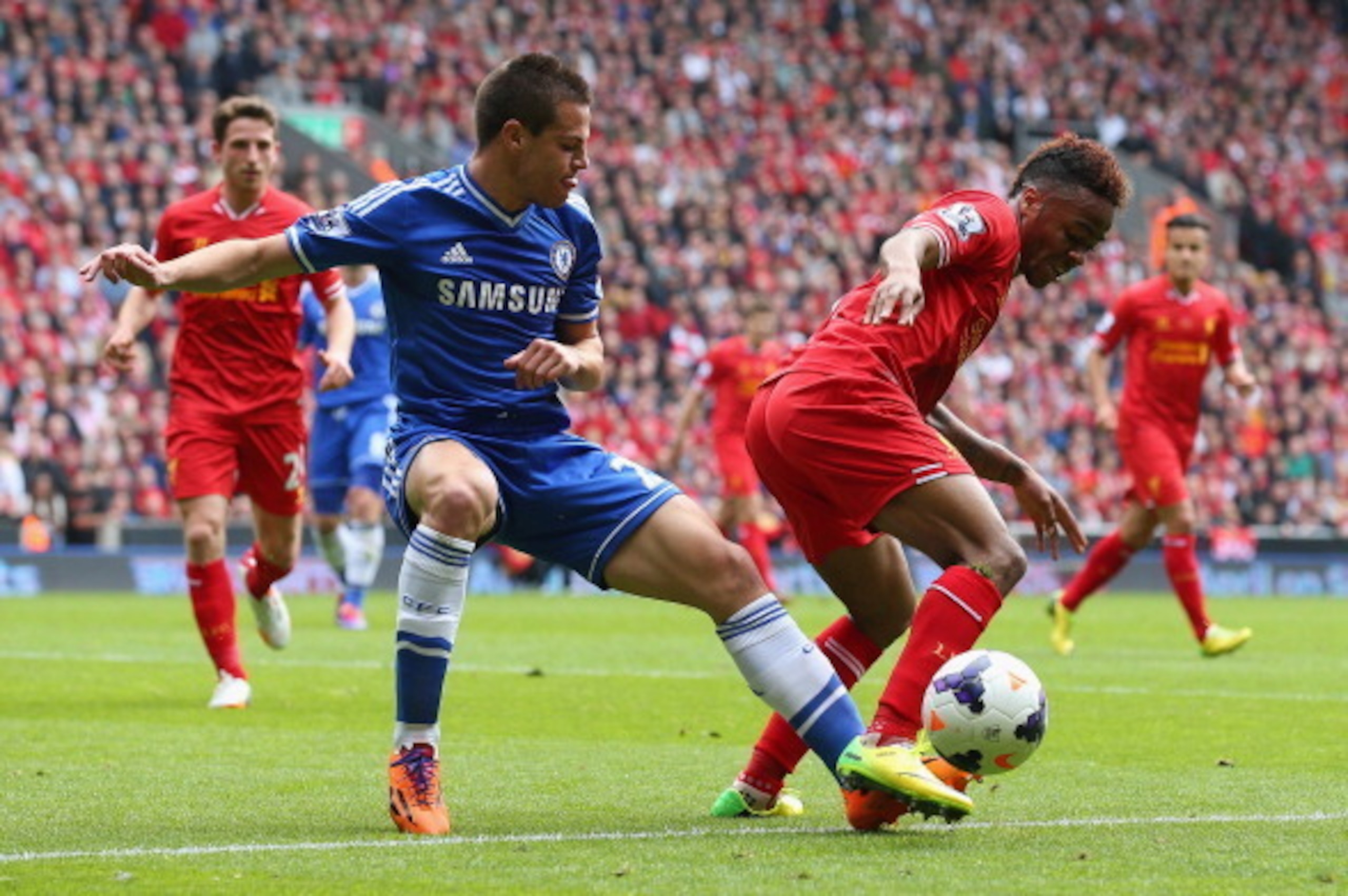 LIVERPOOL, ENGLAND - APRIL 27: Cesar Azpilicueta of Chelsea marshalls Raheem Sterling of Liverpool during the Barclays Premier League match between Liverpool and Chelsea at Anfield on April 27, 2014 in Liverpool, England. (Photo by Clive Brunskill/Getty LIVERPOOL, ENGLAND - APRIL 27: Cesar Azpilicueta of Chelsea marshalls Raheem Sterling of Liverpool during the Barclays Premier League match between Liverpool and Chelsea at Anfield on April 27, 2014 in Liverpool, England. (Photo by Clive Brunskill/Getty