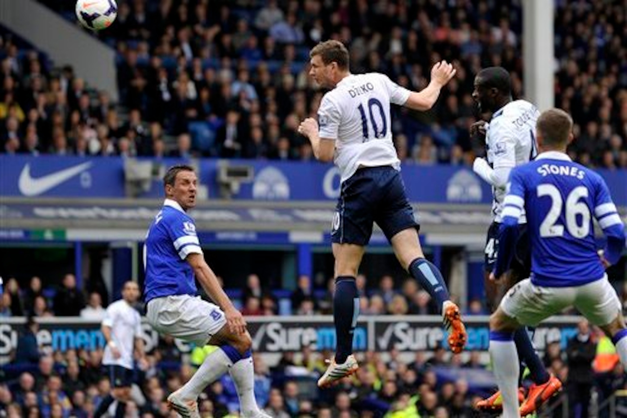 Edin Dzeko's towering header sent Manchester City on the way to victory over Everton.