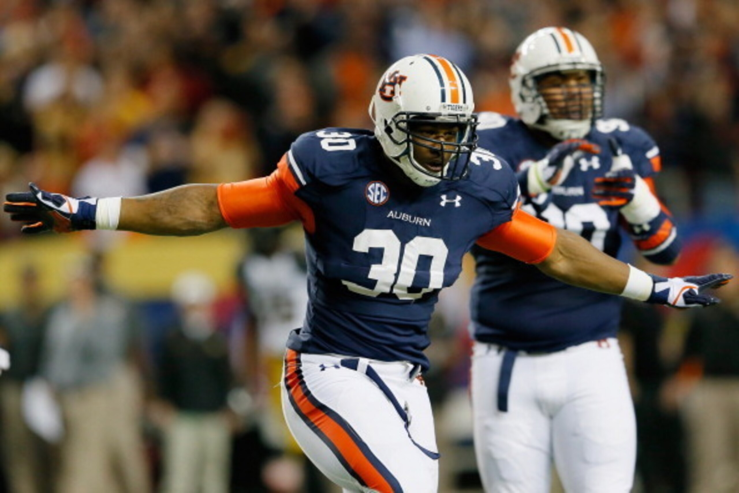 ATLANTA, GA - DECEMBER 07:  Dee Ford #30 of the Auburn Tigers reacts after making a big defensive stop in the first quarter against the Missouri Tigers during the SEC Championship Game at Georgia Dome on December 7, 2013 in Atlanta, Georgia.  (Photo by Ke
