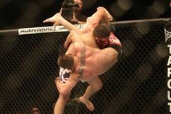 Sep 21, 2013; Toronto, Ontario, CAN; Khabib Nurmagomedov (top) takes down Pat Healy during their Lightweight bout at UFC 165 at the Air Canada Centre. Mandatory Credit: Tom Szczerbowski-USA TODAY Sports