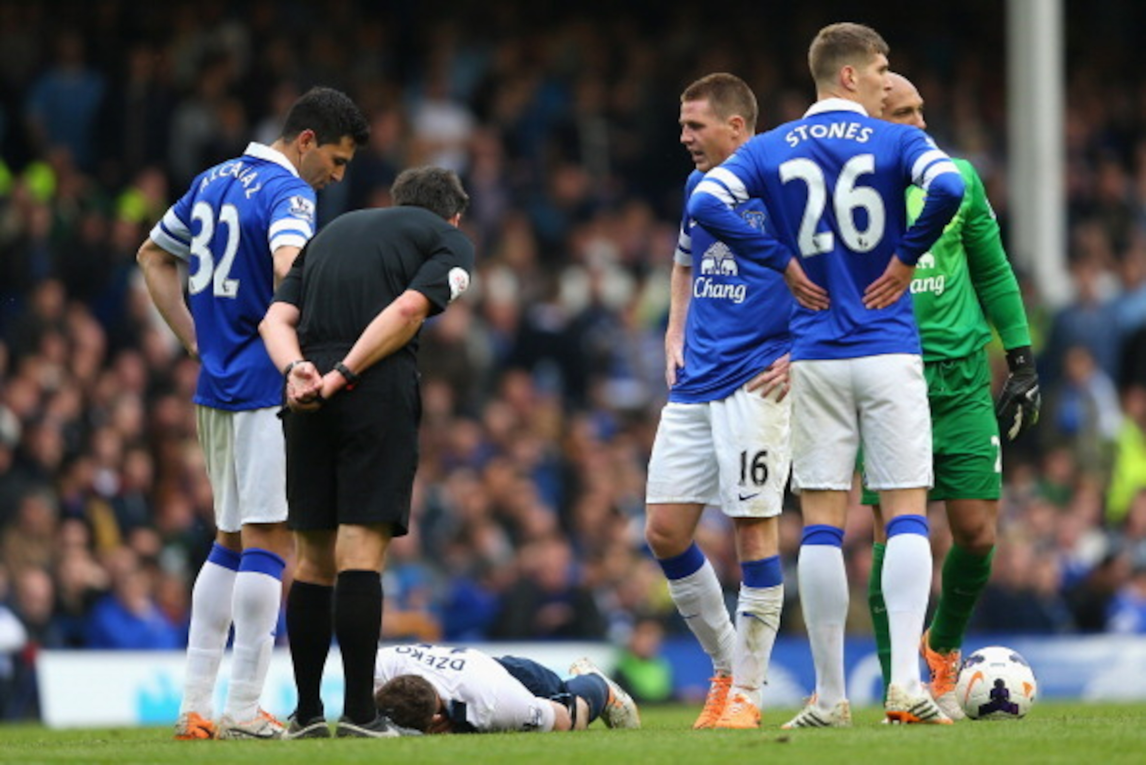 LIVERPOOL, ENGLAND - MAY 03: Antolin Alcaraz of Everton looks on as Edin Dzeko of Manchester City is spoken to by Referee Lee Probert during the Barclays Premier League match between Everton and Manchester City at Goodison Park on May 3, 2014 in Liverpoo LIVERPOOL, ENGLAND - MAY 03: Antolin Alcaraz of Everton looks on as Edin Dzeko of Manchester City is spoken to by Referee Lee Probert during the Barclays Premier League match between Everton and Manchester City at Goodison Park on May 3, 2014 in Liverpoo
