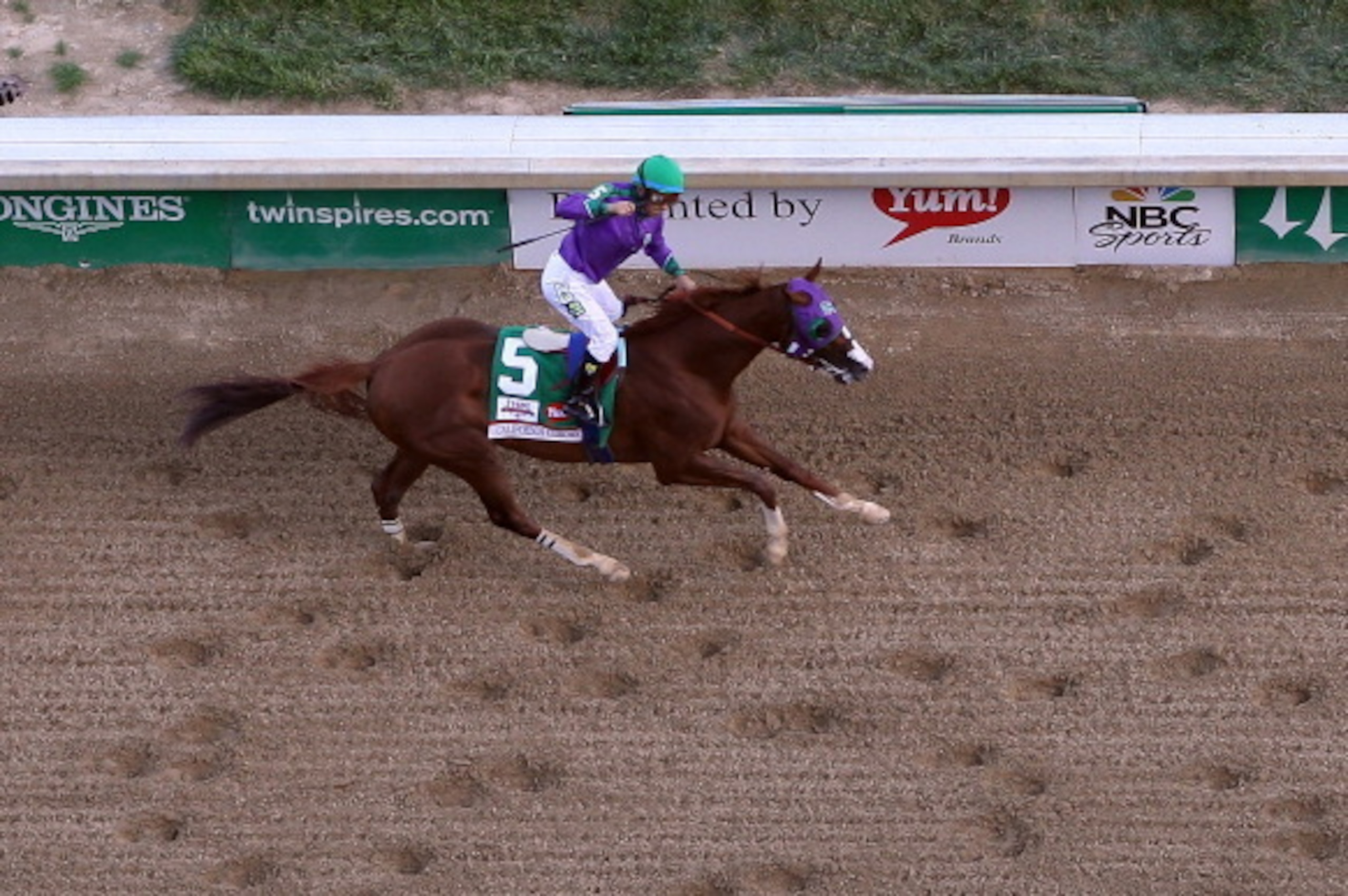 LOUISVILLE, KY - MAY 03:  California Chrome with Victor Espinoza up crosses the finish line to win the 140th running of the Kentucky Derby at Churchill Downs on May 3, 2014 in Louisville, Kentucky.  (Photo by Jamie Squire/Getty Images)