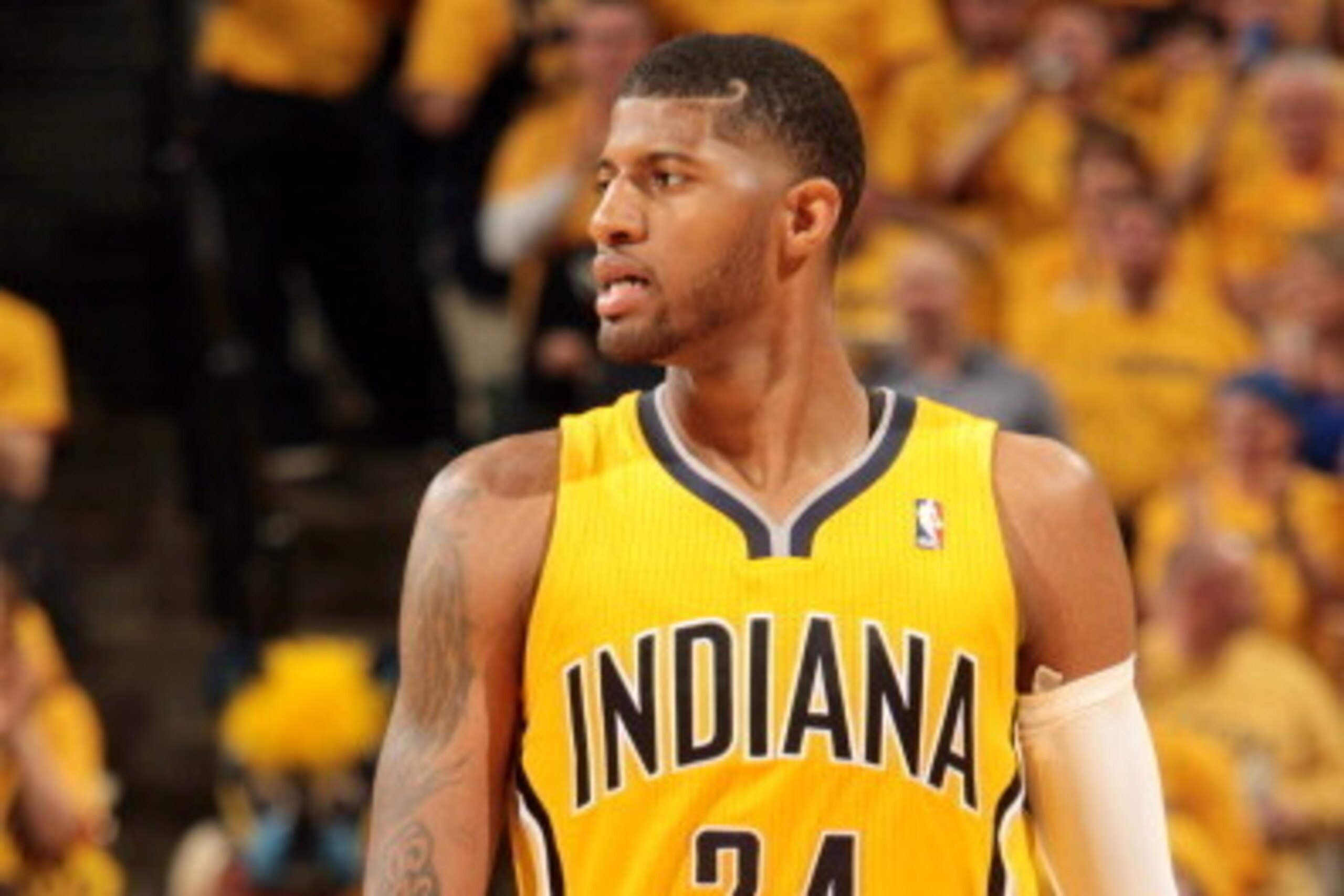 INDIANAPOLIS, IN - MAY 3: Paul George #24 of the Indiana Pacers stands on the court during a game against the Atlanta Hawks in Game Seven of the Eastern Conference Quarterfinals of the 2014 NBA playoffs at Bankers Life Fieldhouse on May 3, 2014 in Indiana INDIANAPOLIS, IN - MAY 3: Paul George #24 of the Indiana Pacers stands on the court during a game against the Atlanta Hawks in Game Seven of the Eastern Conference Quarterfinals of the 2014 NBA playoffs at Bankers Life Fieldhouse on May 3, 2014 in Indiana