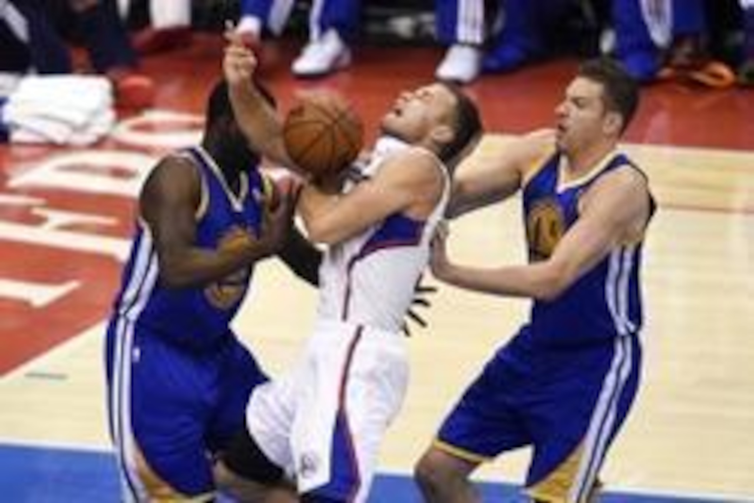 May 3, 2014; Los Angeles, CA, USA; Los Angeles Clippers forward Blake Griffin (32) loses the ball while being defended by Golden State Warriors forward Draymond Green (left) and forward David Lee (right) during the first quarter in game seven of the first