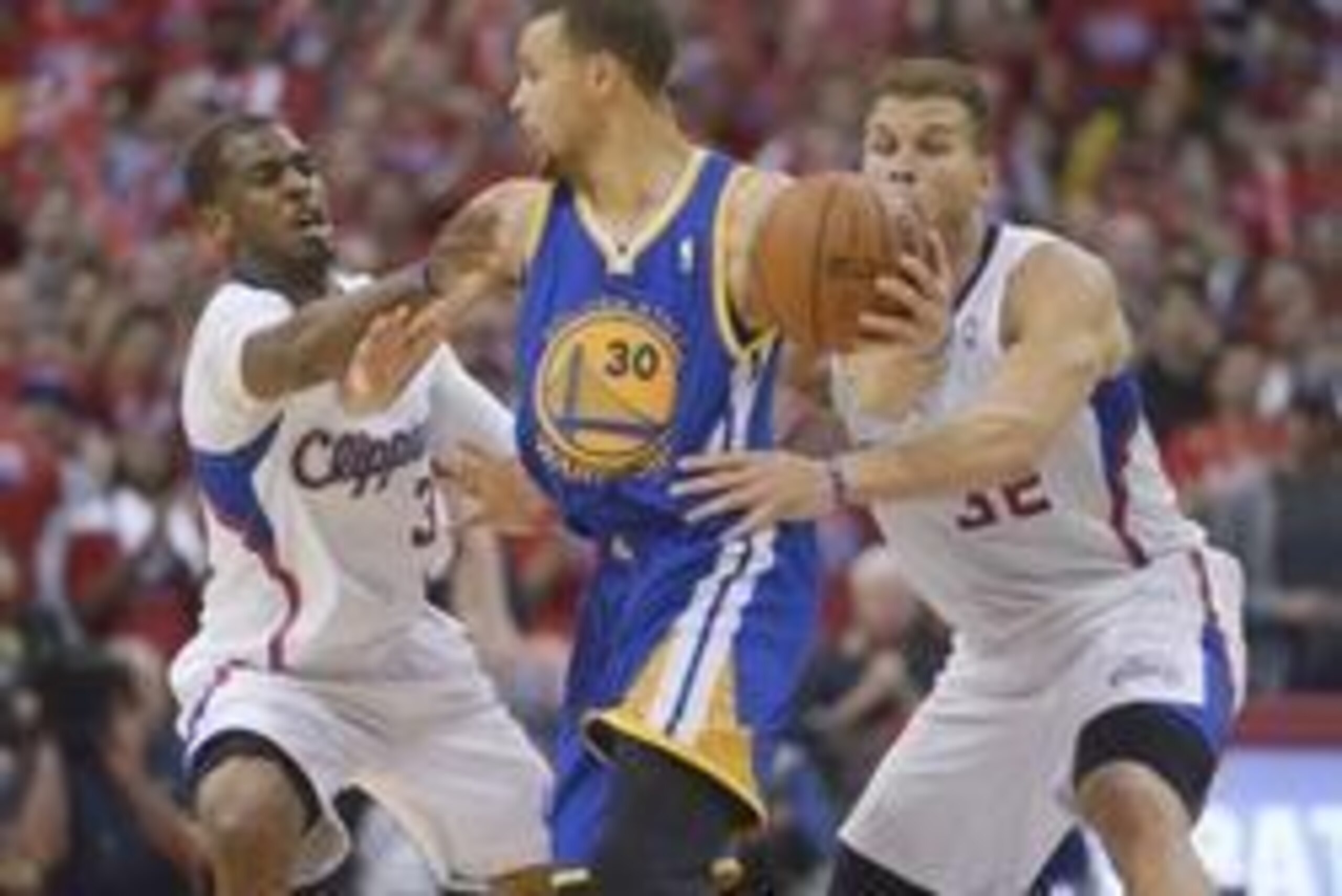 May 3, 2014; Los Angeles, CA, USA; Golden State Warriors guard Stephen Curry (30) is defended by Los Angeles Clippers guard Chris Paul (3) and forward Blake Griffin (32) during game seven of the first round of the 2014 NBA Playoffs at Staples Center. The 