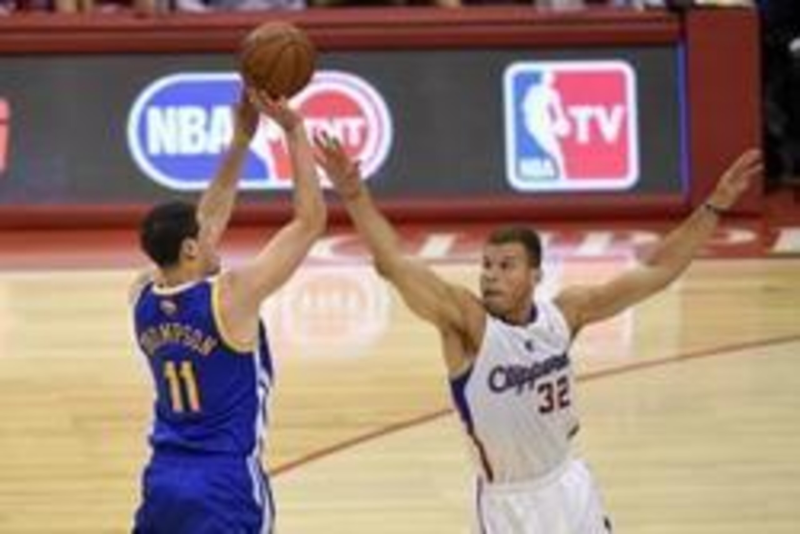 May 3, 2014; Los Angeles, CA, USA; Golden State Warriors guard Klay Thompson (11) attempts shot defended by Los Angeles Clippers forward Blake Griffin (32)  during the first quarter in game seven of the first round of the 2014 NBA Playoffs at Staples Cent