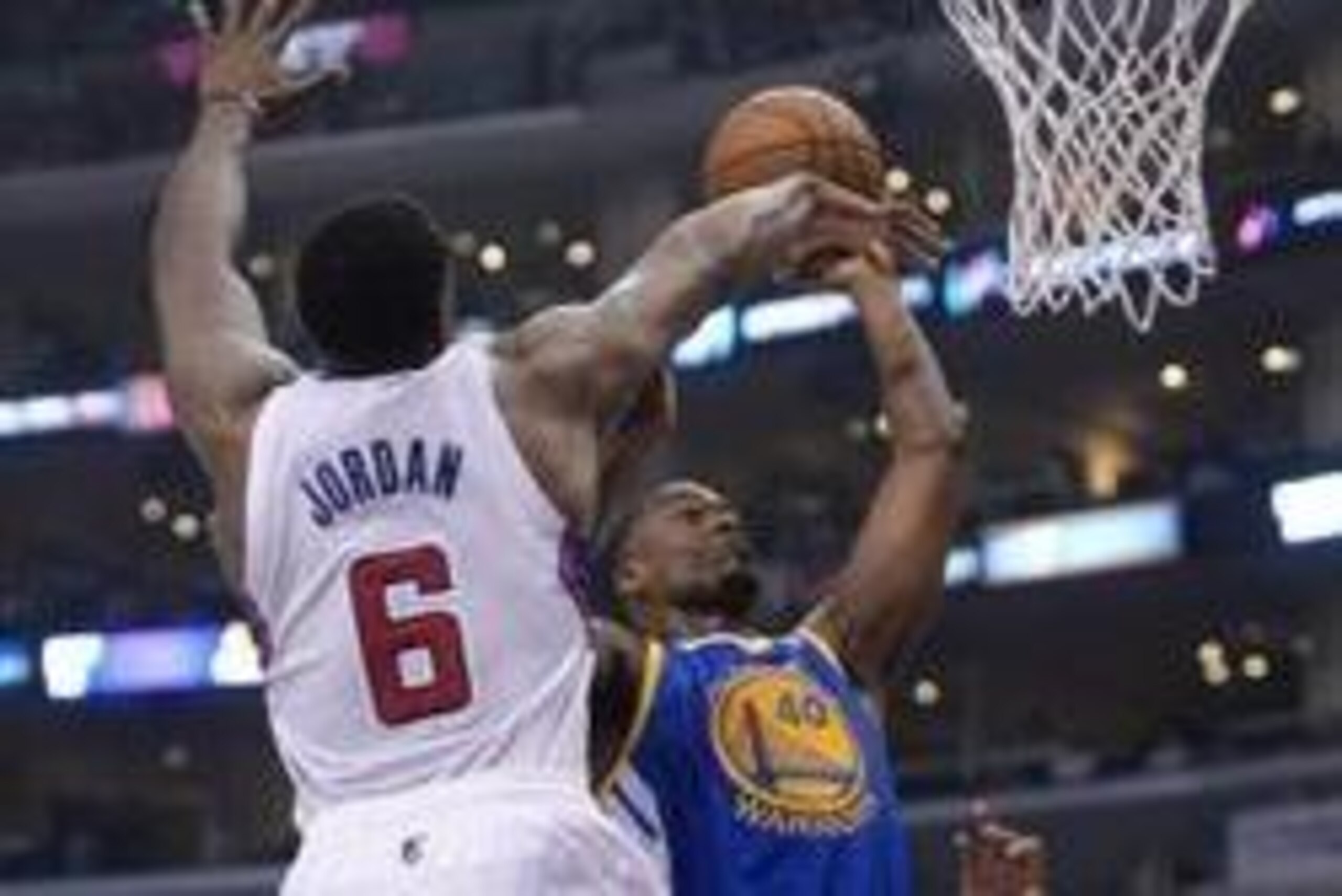 Apr 19, 2014; Los Angeles, CA, USA; Los Angeles Clippers center DeAndre Jordan (6) defends a shot by Golden State Warriors forward Harrison Barnes (40) in the first half in game one during the first round of the 2014 NBA Playoffs at Staples Center. Mandat
