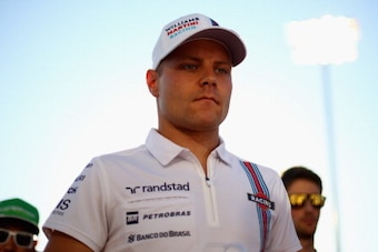 SAKHIR, BAHRAIN - APRIL 06:  Valtteri Bottas of Finland and Williams attends the drivers parade before the Bahrain Formula One Grand Prix at the Bahrain International Circuit on April 6, 2014 in Sakhir, Bahrain.  (Photo by Paul Gilham/Getty Images)