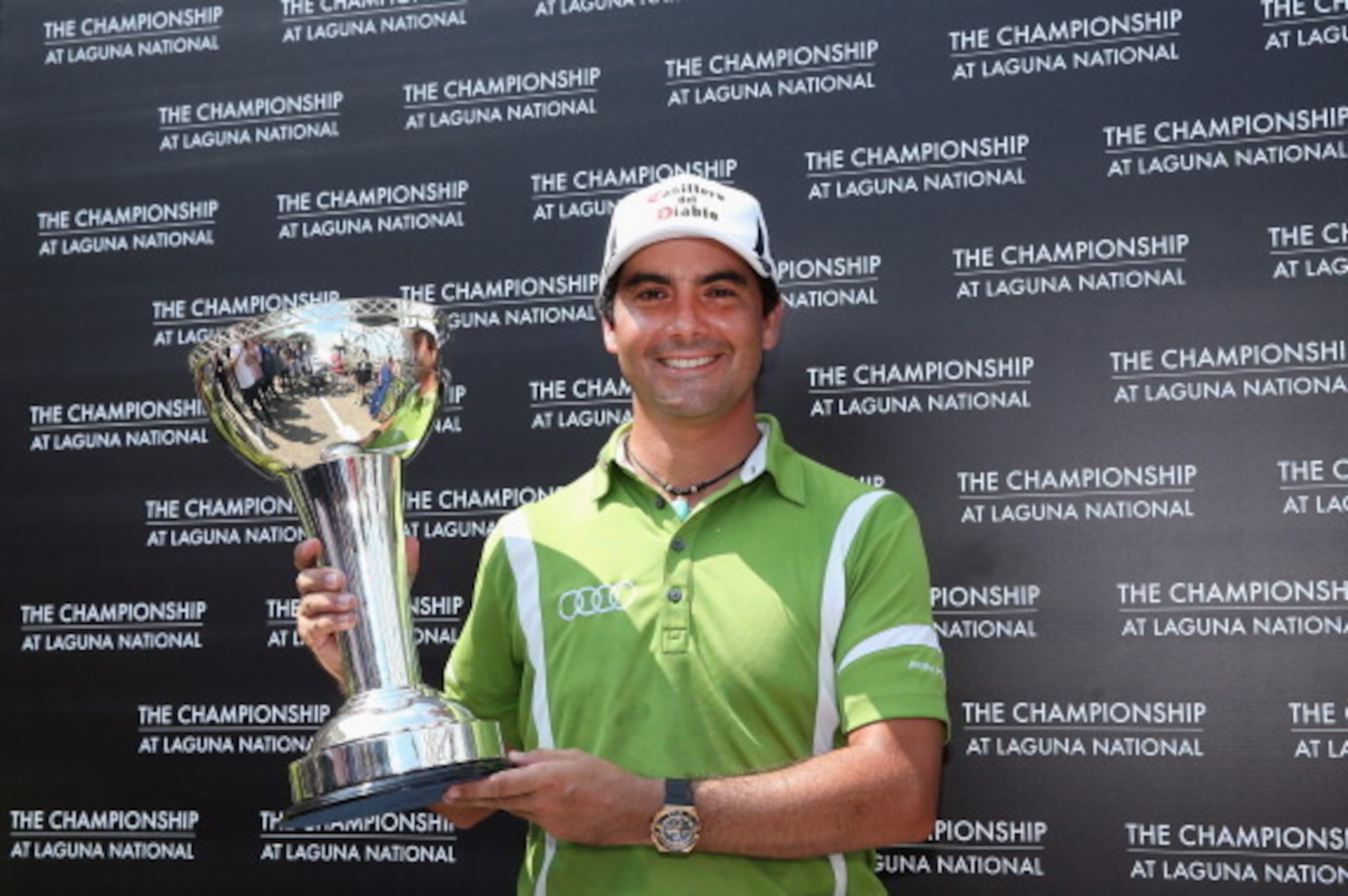 SINGAPORE - MAY 04:  Felipe Aguilar of Chile poses with the trophy after winning The Championship at Laguna National held at Laguna National Golf & Country Club on May 4, 2014 in Singapore.  (Photo by Andrew Redington/Getty Images)