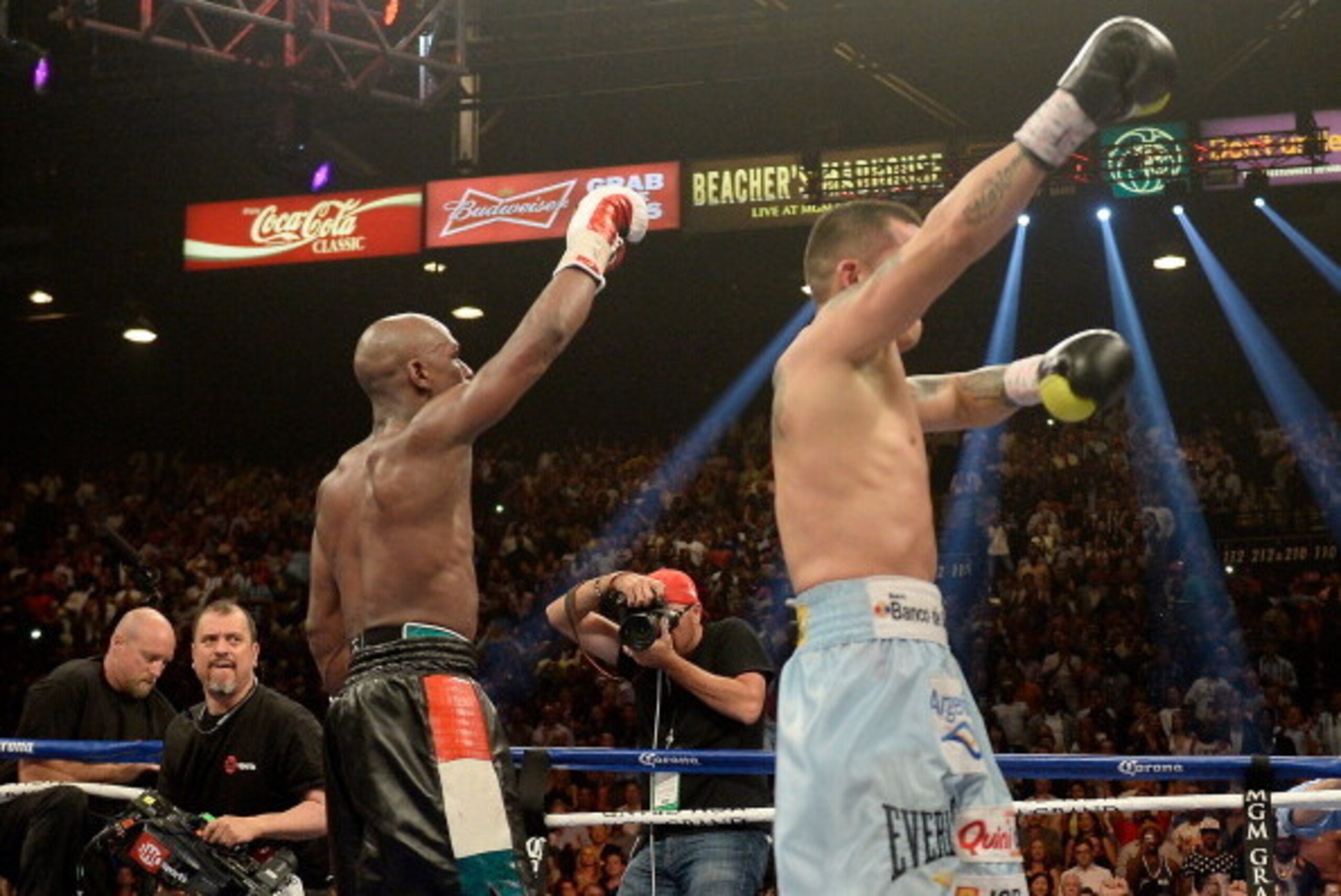 LAS VEGAS, NV - MAY 03:  (L-R) Floyd Mayweather Jr. and Marcos Maidana both put up their arms after the 12th round during their WBC/WBA welterweight unification fight at the MGM Grand Garden Arena on May 3, 2014 in Las Vegas, Nevada.  (Photo by Harry How/