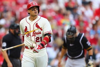 ST. LOUIS, MO - APRIL 26: Allen Craig #21 of the St. Louis Cardinals returns to the dugout after striking out against the Pittsburgh Pirates in the eighth inning at Busch Stadium on April 26, 2014 in St. Louis, Missouri.  The Pirates beat the Cardinals 6-