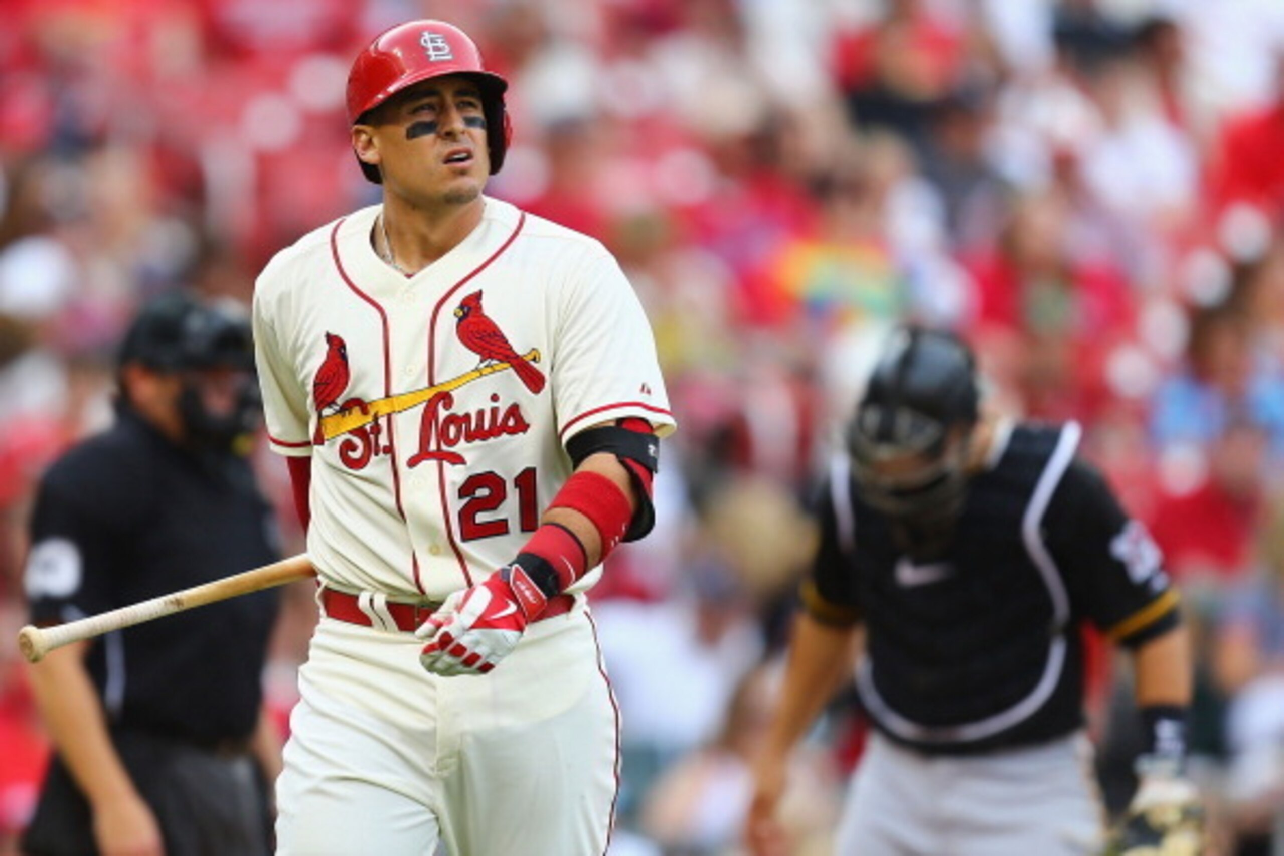 ST. LOUIS, MO - APRIL 26: Allen Craig #21 of the St. Louis Cardinals returns to the dugout after striking out against the Pittsburgh Pirates in the eighth inning at Busch Stadium on April 26, 2014 in St. Louis, Missouri.  The Pirates beat the Cardinals 6-