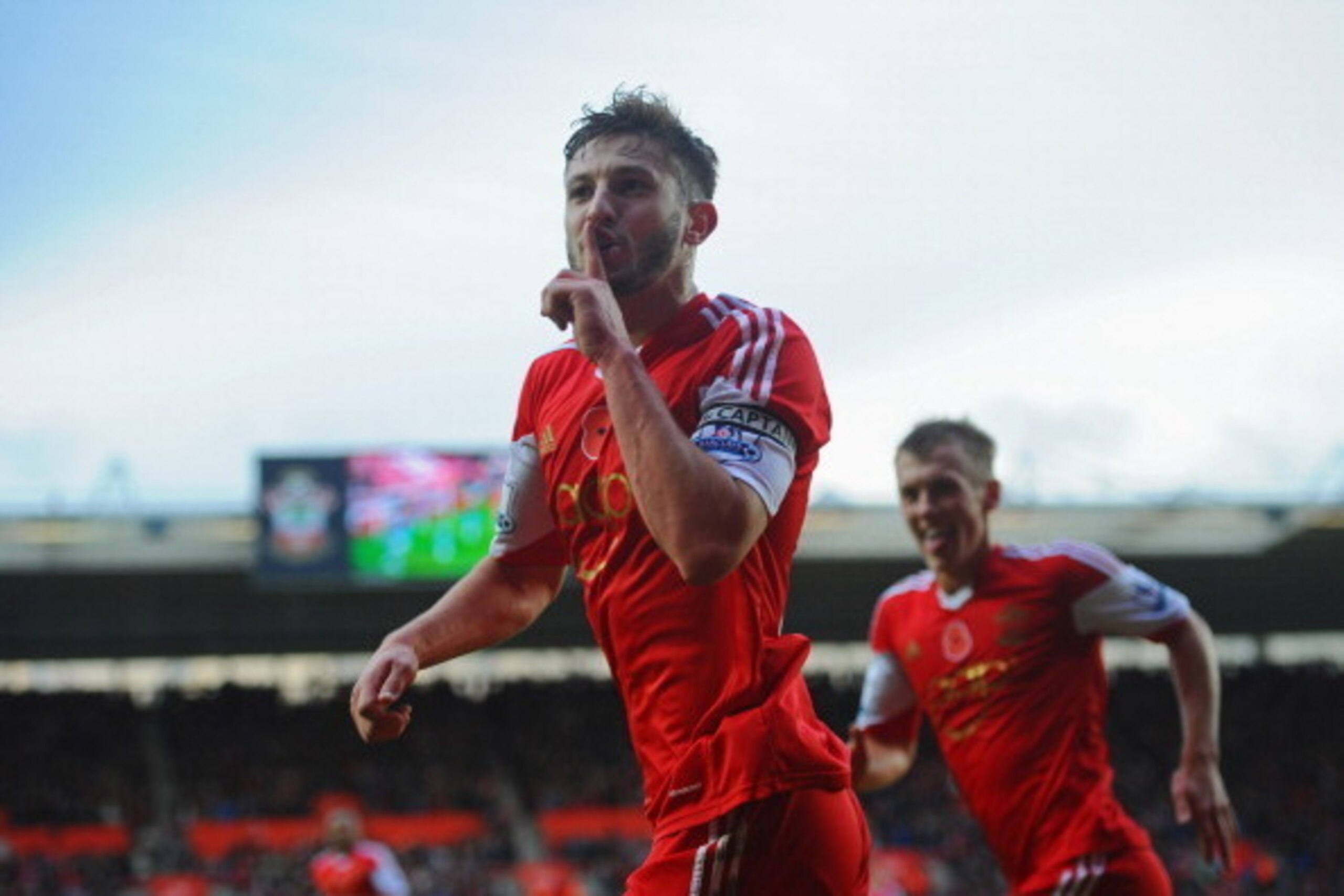 SOUTHAMPTON, ENGLAND - NOVEMBER 09:  Adam Lallana of Southampton celebrates as he scores their third goal during the Barclays Premier League match between Southampton and Hull City at St Mary's Stadium on November 9, 2013 in Southampton, England.  (Photo 