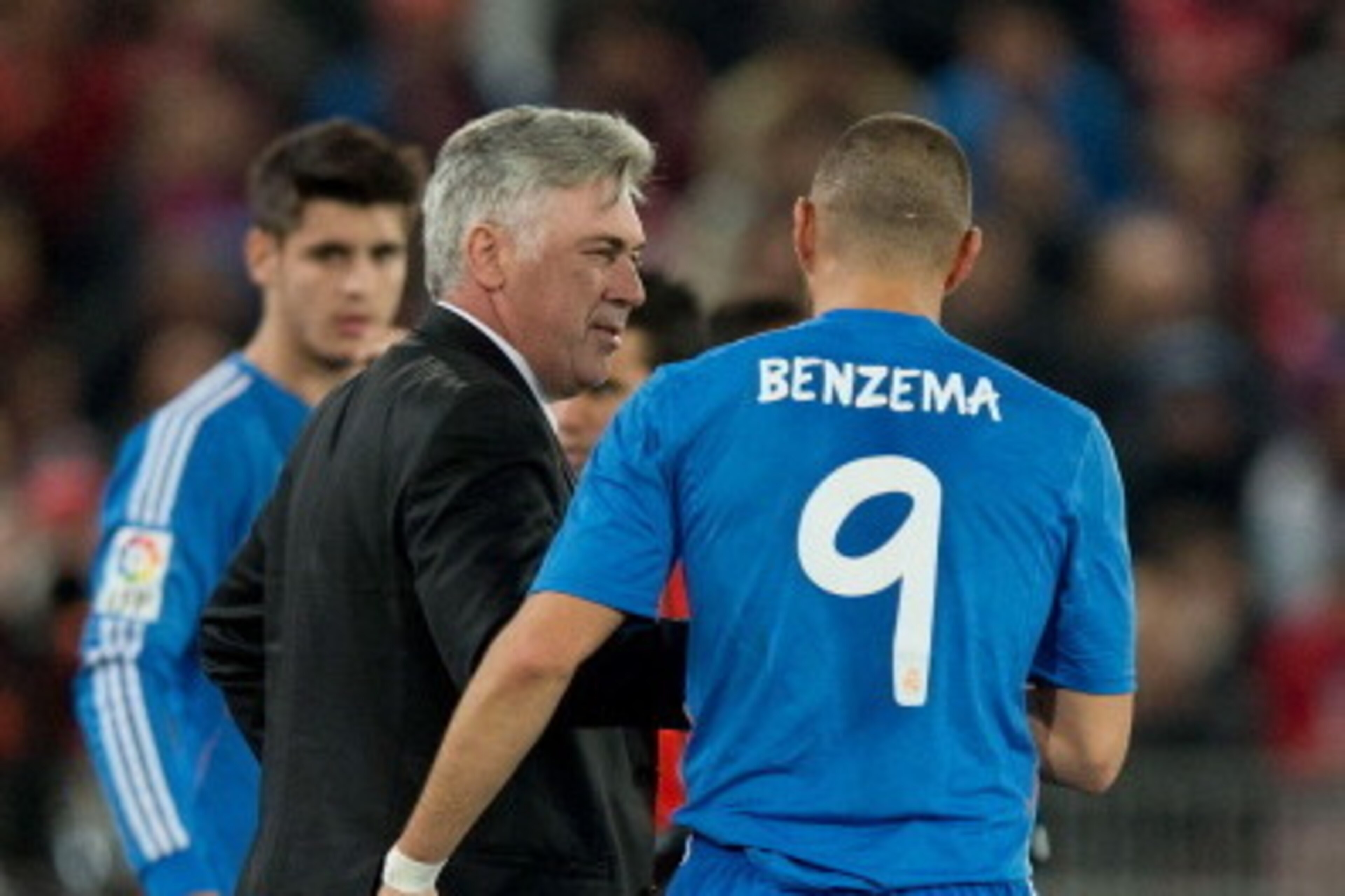 ALMERIA, SPAIN - NOVEMBER 23: Karim Benzema of Real Madrid CF celebrates scoring their second goal with his head coach Carlo Ancelotti before being replaced by Alvaro B. Morata (L) during the La Liga match between UD Almeria and Real Madrid CF at Estadio ALMERIA, SPAIN - NOVEMBER 23: Karim Benzema of Real Madrid CF celebrates scoring their second goal with his head coach Carlo Ancelotti before being replaced by Alvaro B. Morata (L) during the La Liga match between UD Almeria and Real Madrid CF at Estadio