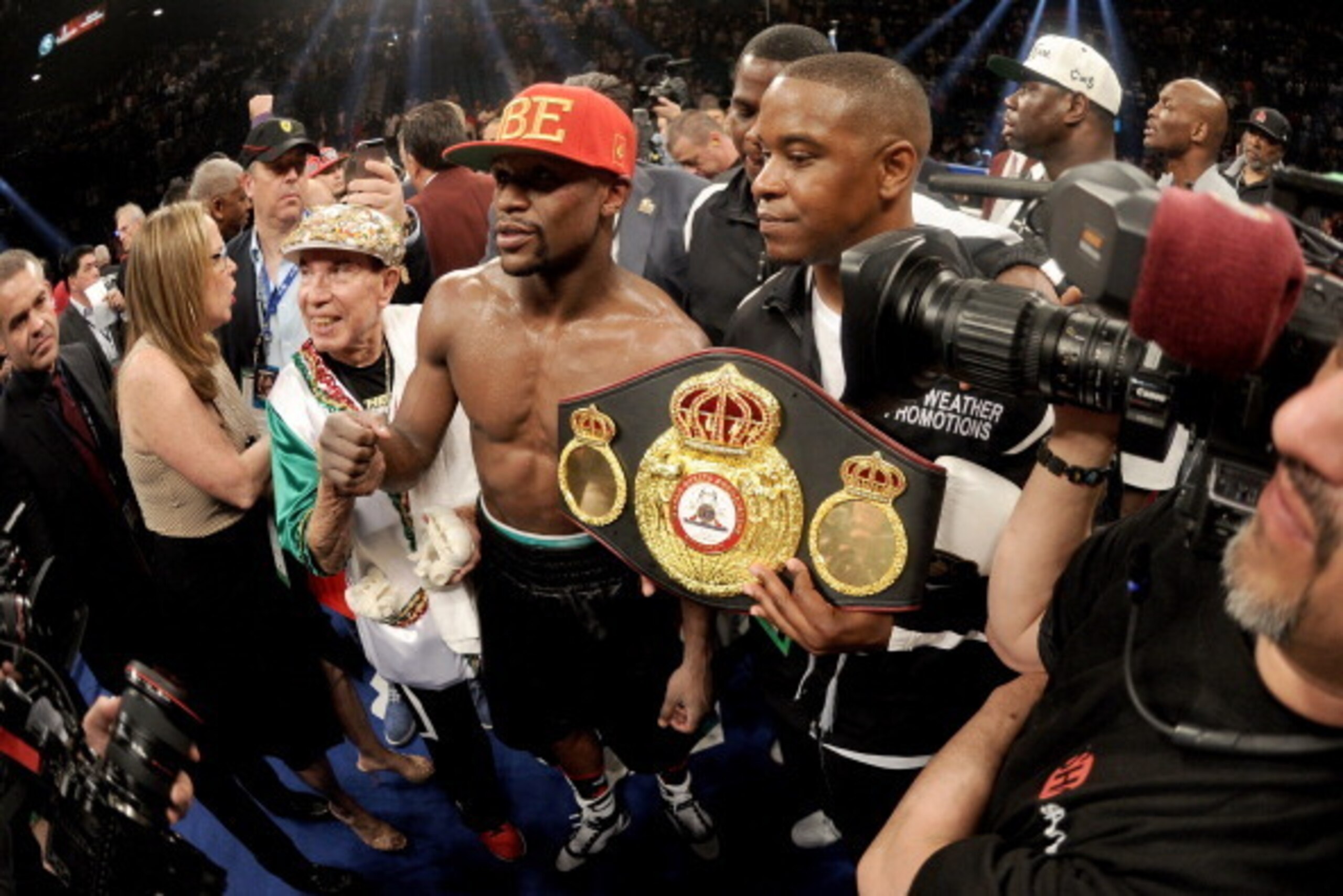 LAS VEGAS, NV - MAY 03:  Floyd Mayweather Jr. celebrates after defeating Marcos Maidana by majority decision in their WBC/WBA welterweight unification fight at the MGM Grand Garden Arena on May 3, 2014 in Las Vegas, Nevada.  (Photo by Harry How/Getty Imag