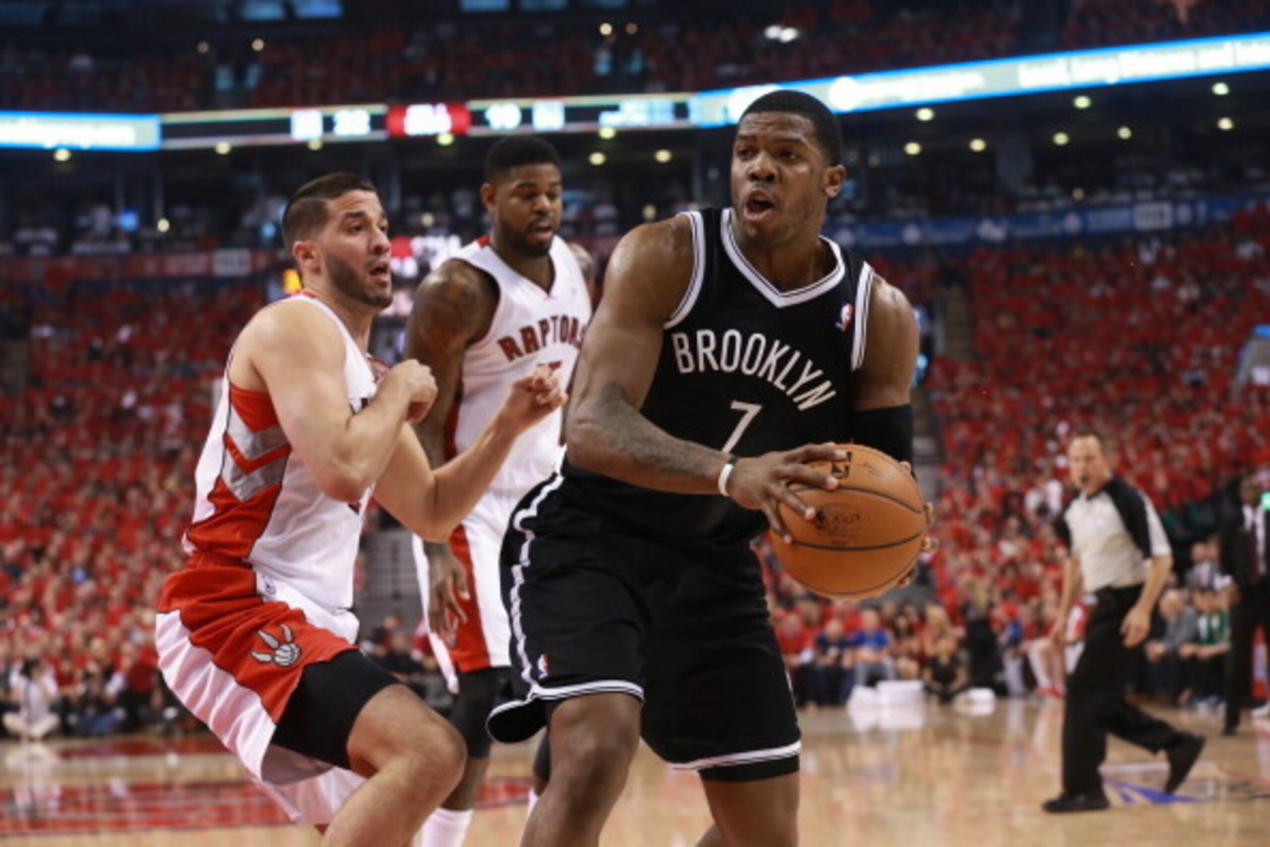TORONTO,ON - MAY 4: Joe Johnson #7 of the Brooklyn Nets drives to the basket during Game seven of the Quarterfinal NBA Eastern Conference playoff game against Greivis Vasquez #21 of the Toronto Raptors at the Air Canada Centre on May 4, 2014 in Toronto, O