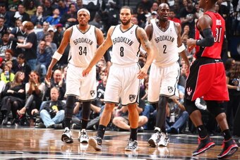 BROOKLYN, NY - APRIL 27:  Paul Pierce #34, Deron Williams #8 and Kevin Garnett #2 of the Brooklyn Nets walk up court against the Toronto Raptors during Game Four of the Eastern Conference Quarterfinals  at Barclays Center in Brooklyn. NOTE TO USER: User e