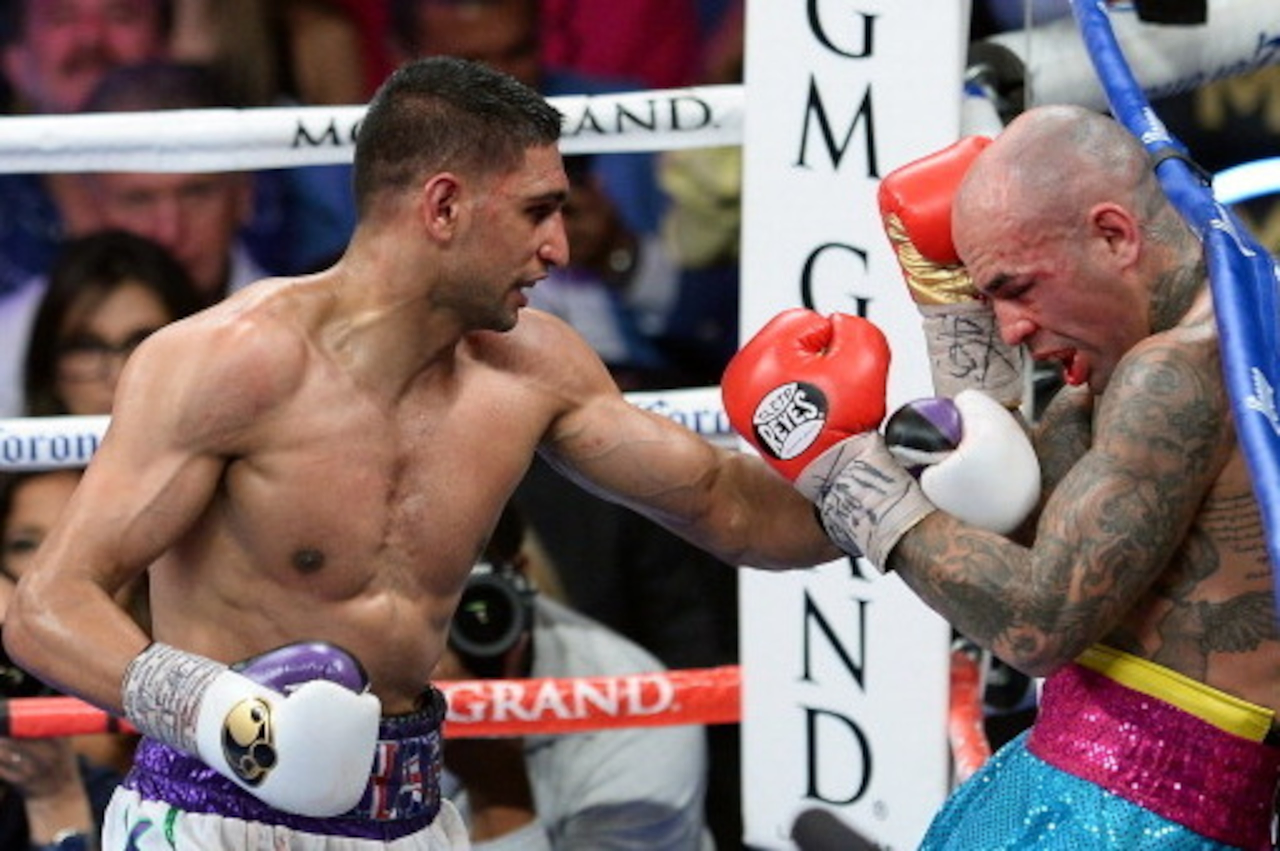 LAS VEGAS, NV - MAY 03: Amir Khan (L) hits Luis Collazo in the 10th round of their welterweight bout at the MGM Grand Garden Arena on May 3, 2014 in Las Vegas, Nevada. Khan won by unanimous decision. (Photo by Ethan Miller/Getty Images) LAS VEGAS, NV - MAY 03: Amir Khan (L) hits Luis Collazo in the 10th round of their welterweight bout at the MGM Grand Garden Arena on May 3, 2014 in Las Vegas, Nevada. Khan won by unanimous decision. (Photo by Ethan Miller/Getty Images)