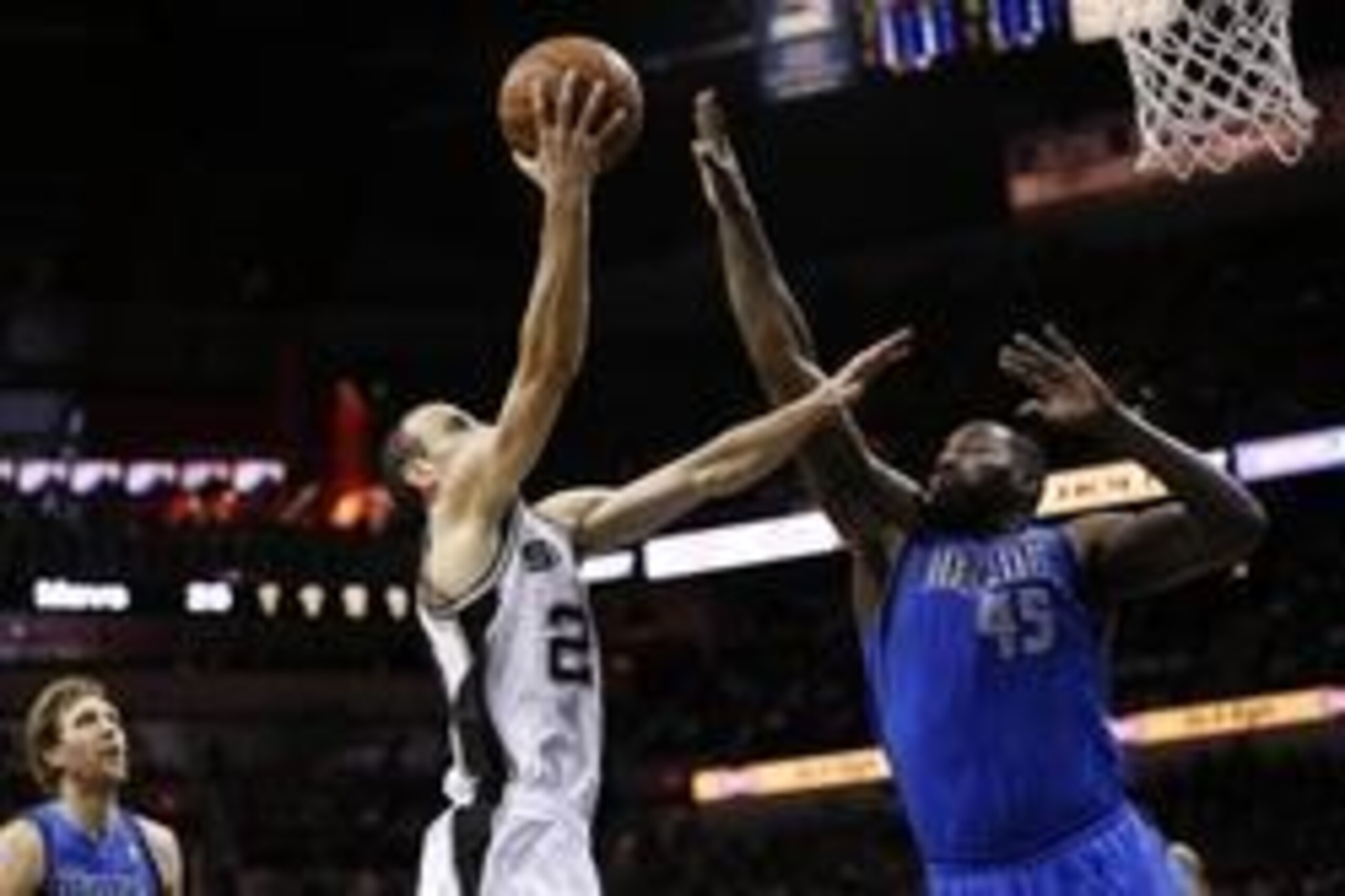 May 4, 2014; San Antonio, TX, USA; San Antonio Spurs guard Manu Ginobili (20) drives to the basket as Dallas Mavericks center DeJuan Blair (45) defends in game seven of the first round of the 2014 NBA Playoffs at AT&T Center. Mandatory Credit: Soobum Im-U