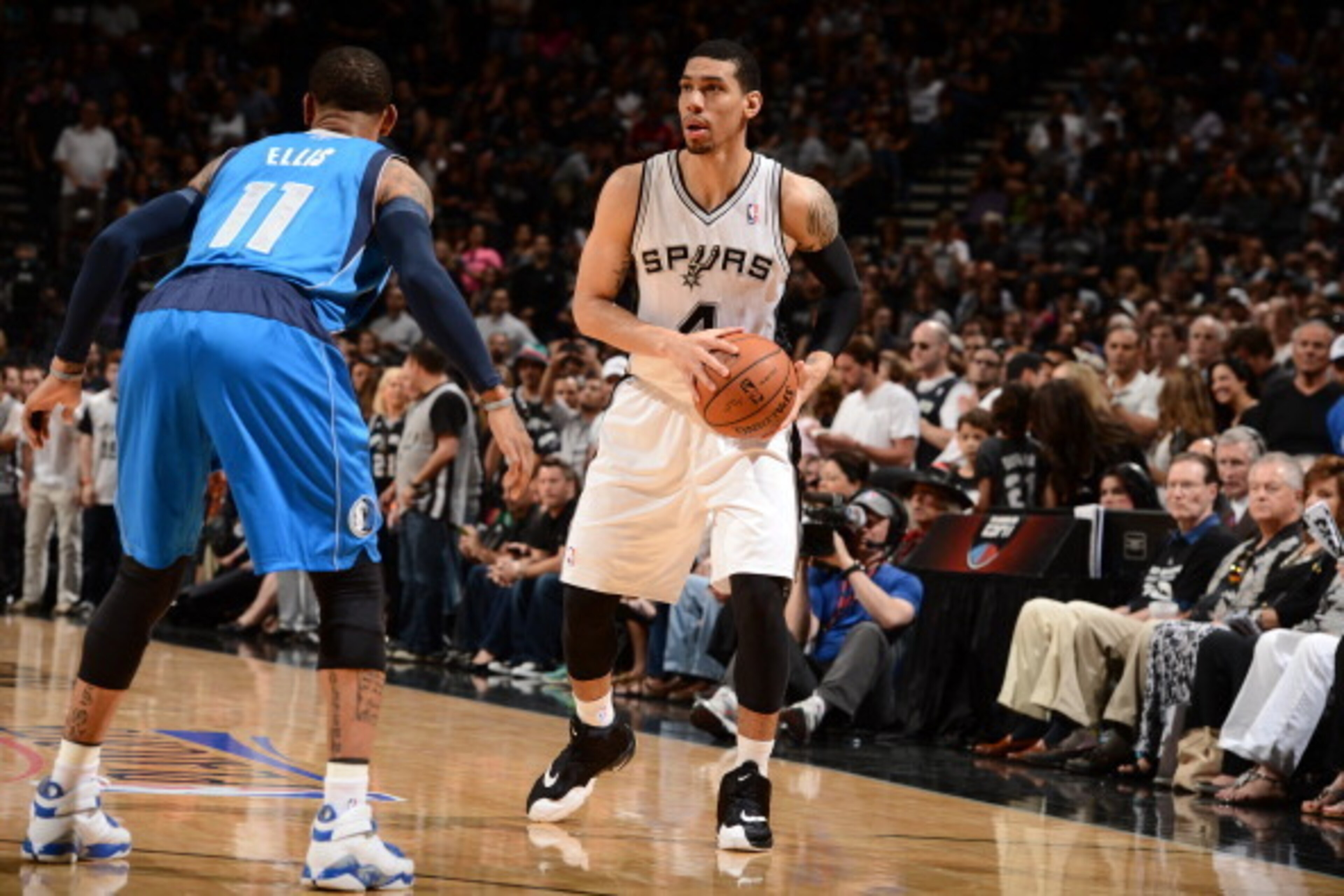 SAN ANTONIO, TX - MAY 4: Danny Green #4 of the San Antonio Spurs looks to pass the ball against the Dallas Mavericks in Game Seven of the Western Conference Quarterfinals during the 2014 NBA Playoffs on MAY 4, 2014 at the AT&T Center in San Antonio, Texas SAN ANTONIO, TX - MAY 4: Danny Green #4 of the San Antonio Spurs looks to pass the ball against the Dallas Mavericks in Game Seven of the Western Conference Quarterfinals during the 2014 NBA Playoffs on MAY 4, 2014 at the AT&T Center in San Antonio, Texas