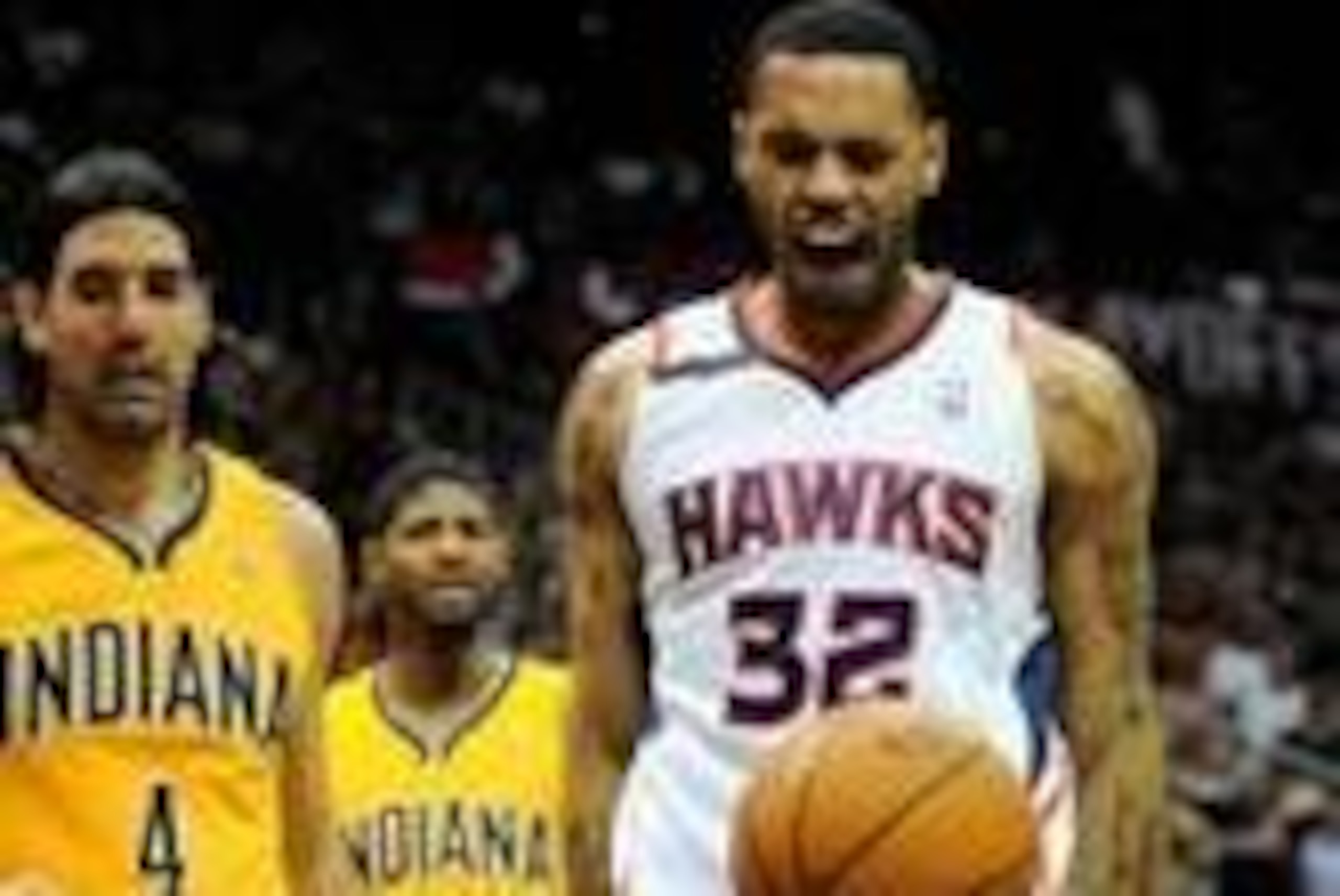 Apr 26, 2014; Atlanta, GA, USA; Atlanta Hawks forward Mike Scott (32) reacts after a basket in front of Indiana Pacers forward Luis Scola (4) during the first half in game four of the first round of the 2014 NBA Playoffs at Philips Arena. Mandatory Credit