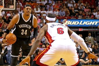 MIAMI, FL - APRIL 08:  LeBron James #6 of the Miami Heat guards Paul Pierce #34 of the Brooklyn Nets during a game  at AmericanAirlines Arena on April 8, 2014 in Miami, Florida. NOTE TO USER: User expressly acknowledges and agrees that, by downloading and