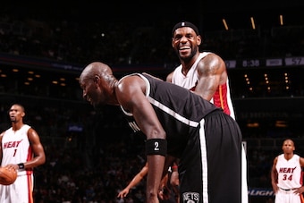 NEW YORK, NY - JANUARY 10: LeBron James #6 of the Miami Heat and Kevin Garnett #2 of the Brooklyn Nets during a game at the Barclays Center on January 10, 2014 in the Brooklyn borough of New York City.  NOTE TO USER: User expressly acknowledges and agrees