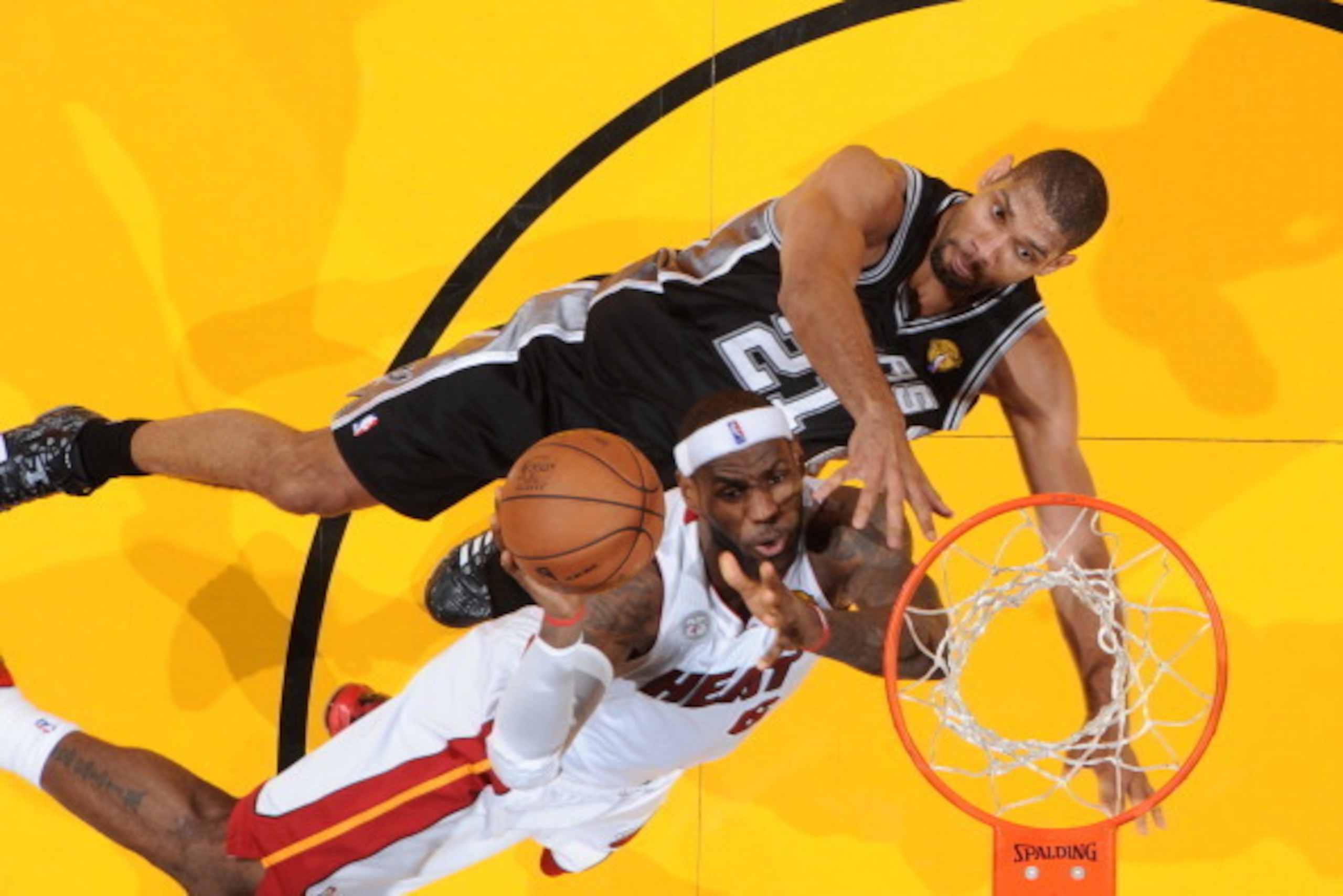 MIAMI, FL - JUNE 18: LeBron James #6 of the Miami Heat attempts a shot while being guarded by Tim Duncan #21 of the San Antonio Spurs during Game Six of the 2013 NBA Finals on June 18, 2013 at the American Airlines Arena in Miami, Florida. NOTE TO USER: U
