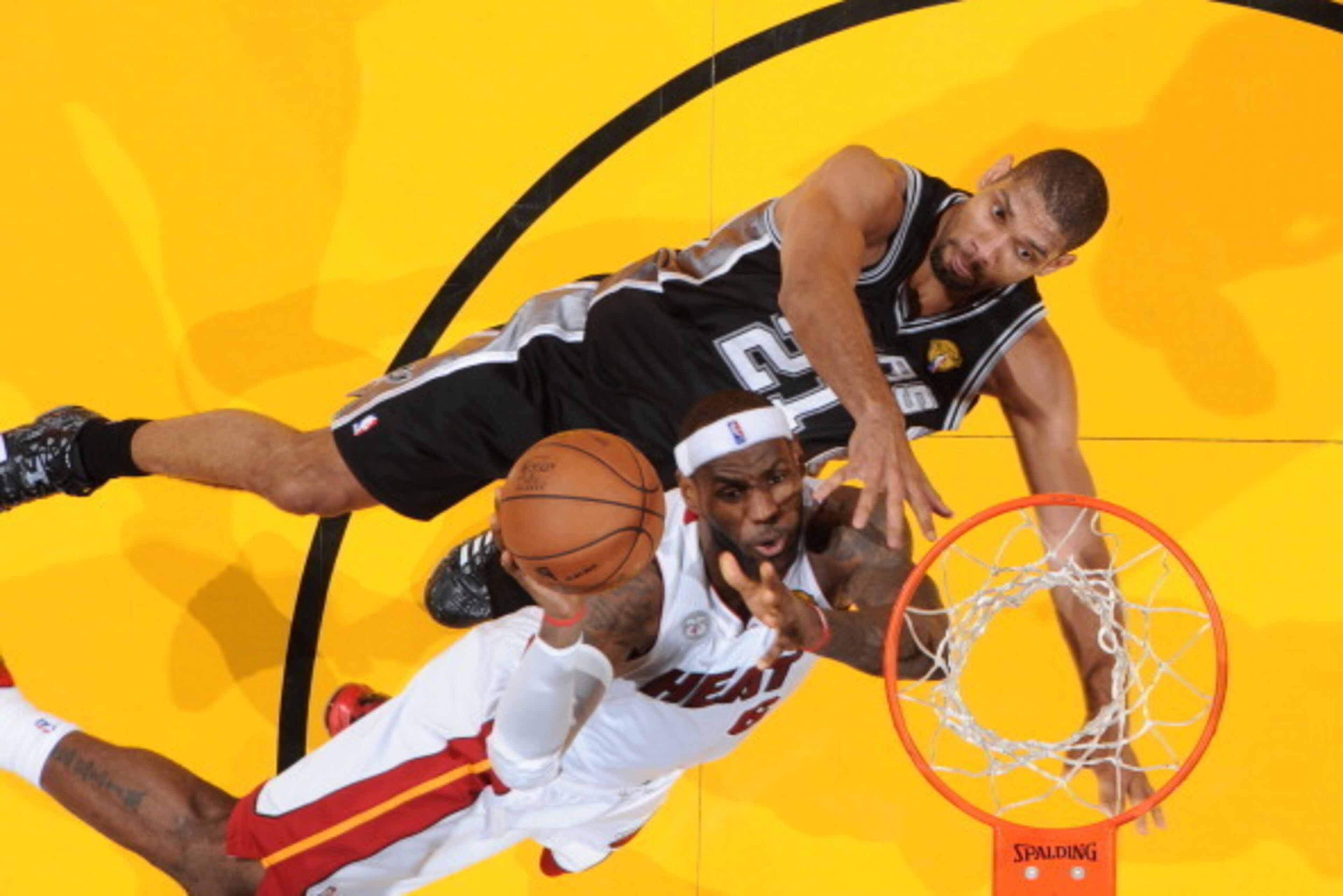 MIAMI, FL - JUNE 18: LeBron James #6 of the Miami Heat attempts a shot while being guarded by Tim Duncan #21 of the San Antonio Spurs during Game Six of the 2013 NBA Finals on June 18, 2013 at the American Airlines Arena in Miami, Florida. NOTE TO USER: U