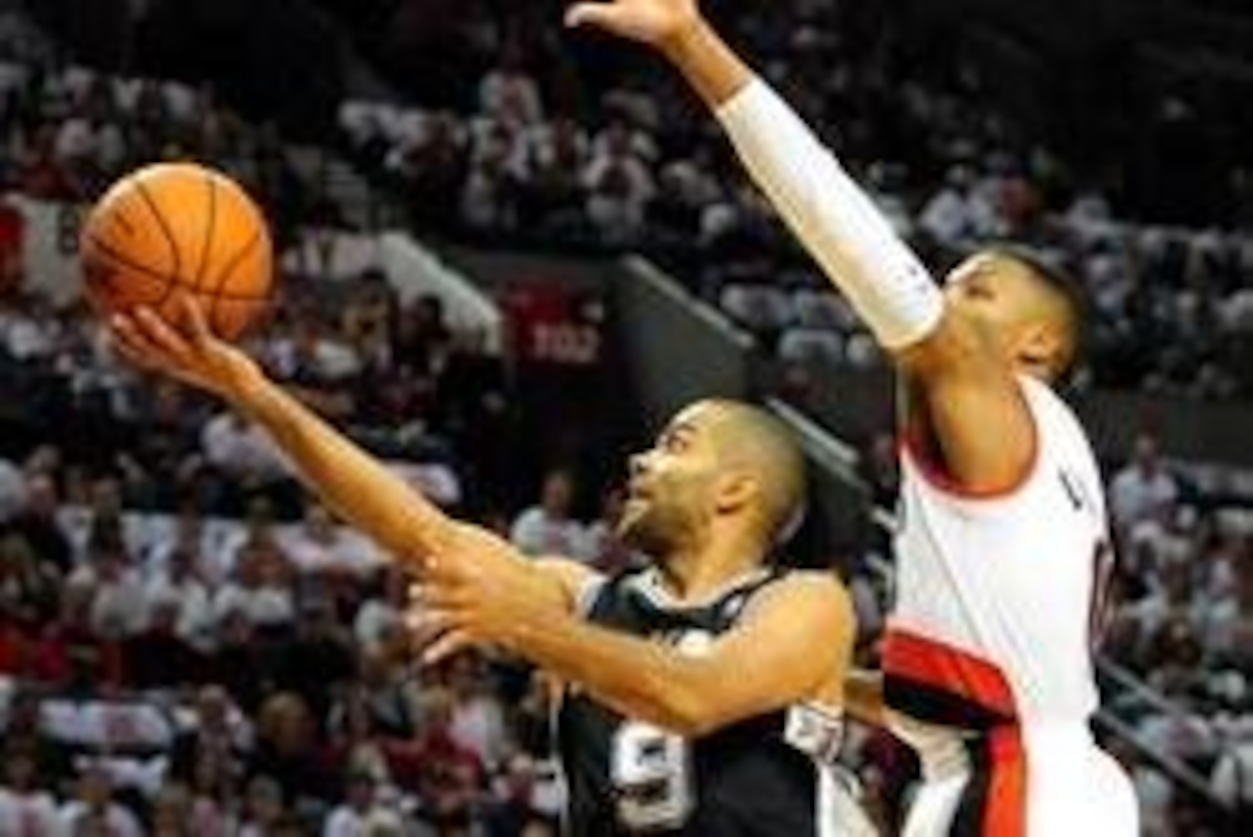 Nov 2, 2013; Portland, OR, USA; San Antonio Spurs point guard Tony Parker (9) drives to the basket on Portland Trail Blazers point guard Damian Lillard (0) during the first quarter of the game at the Moda Center. Mandatory Credit: Steve Dykes-USA TODAY Sp