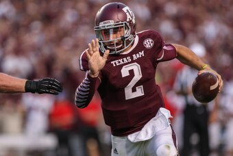 Sep 21, 2013; College Station, TX, USA; Texas A&M Aggies quarterback Johnny Manziel (2) runs with the ball during the second quarter against the Southern Methodist Mustangs at Kyle Field. Mandatory Credit: Troy Taormina-USA TODAY Sports